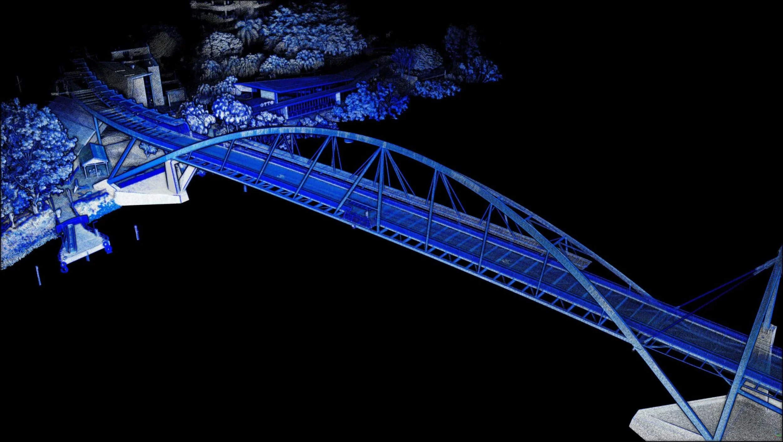 A digitally rendered aerial view of a section of a blue illuminated bridge over water at night, with surrounding trees and structures also illuminated in blue.