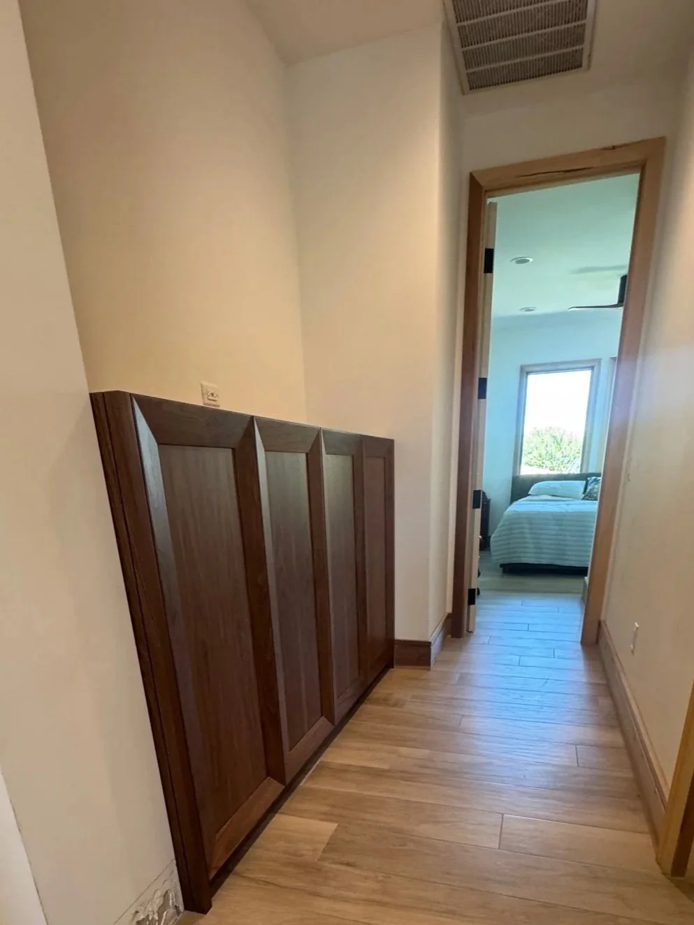 Turn a narrow space into sleek storage with custom cabinets.  Shown in XX finish