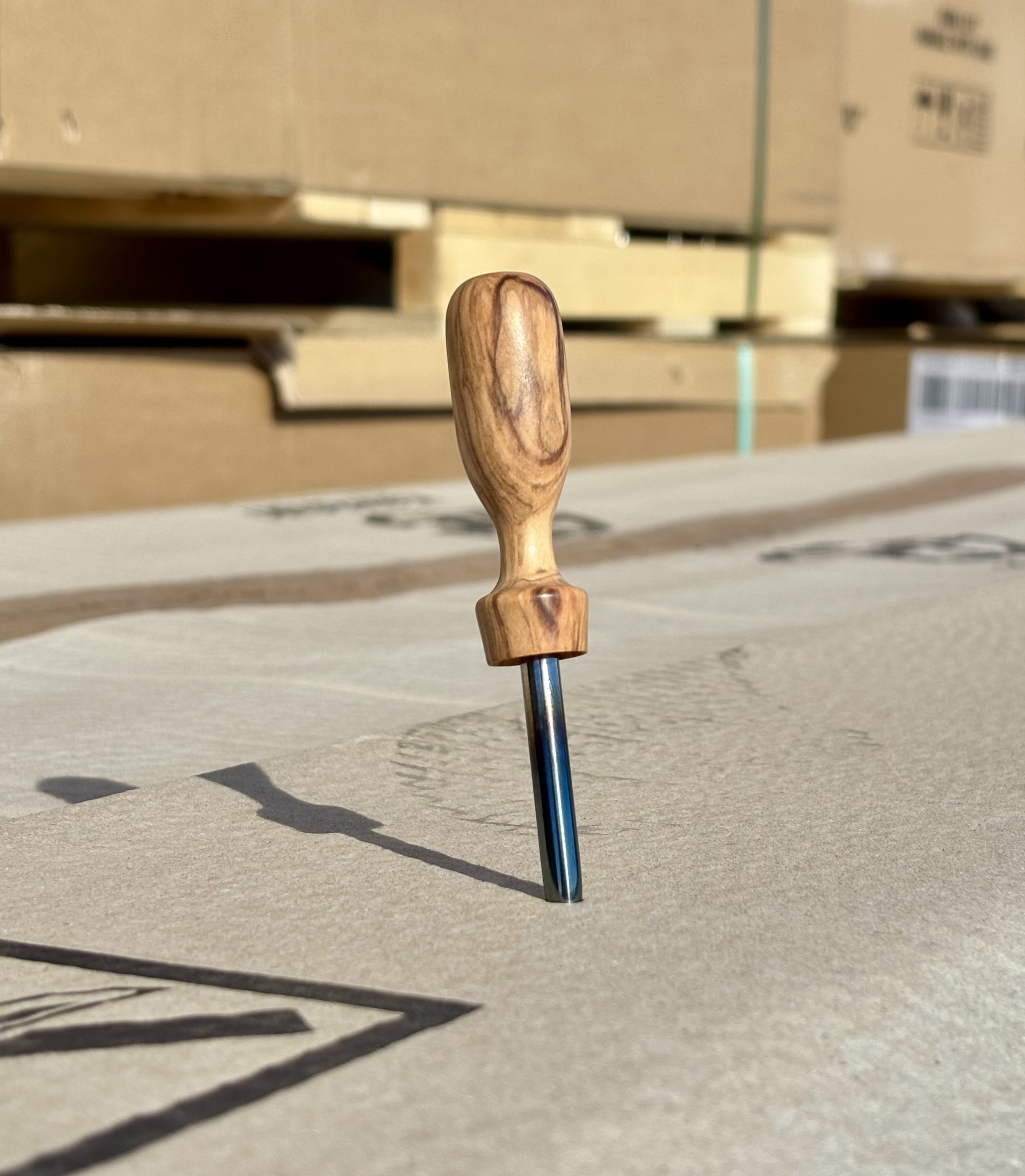 handmade divot tool made from olive wood. Tool is single prong styled and made from steel that is heat treated perfect golf accessorie