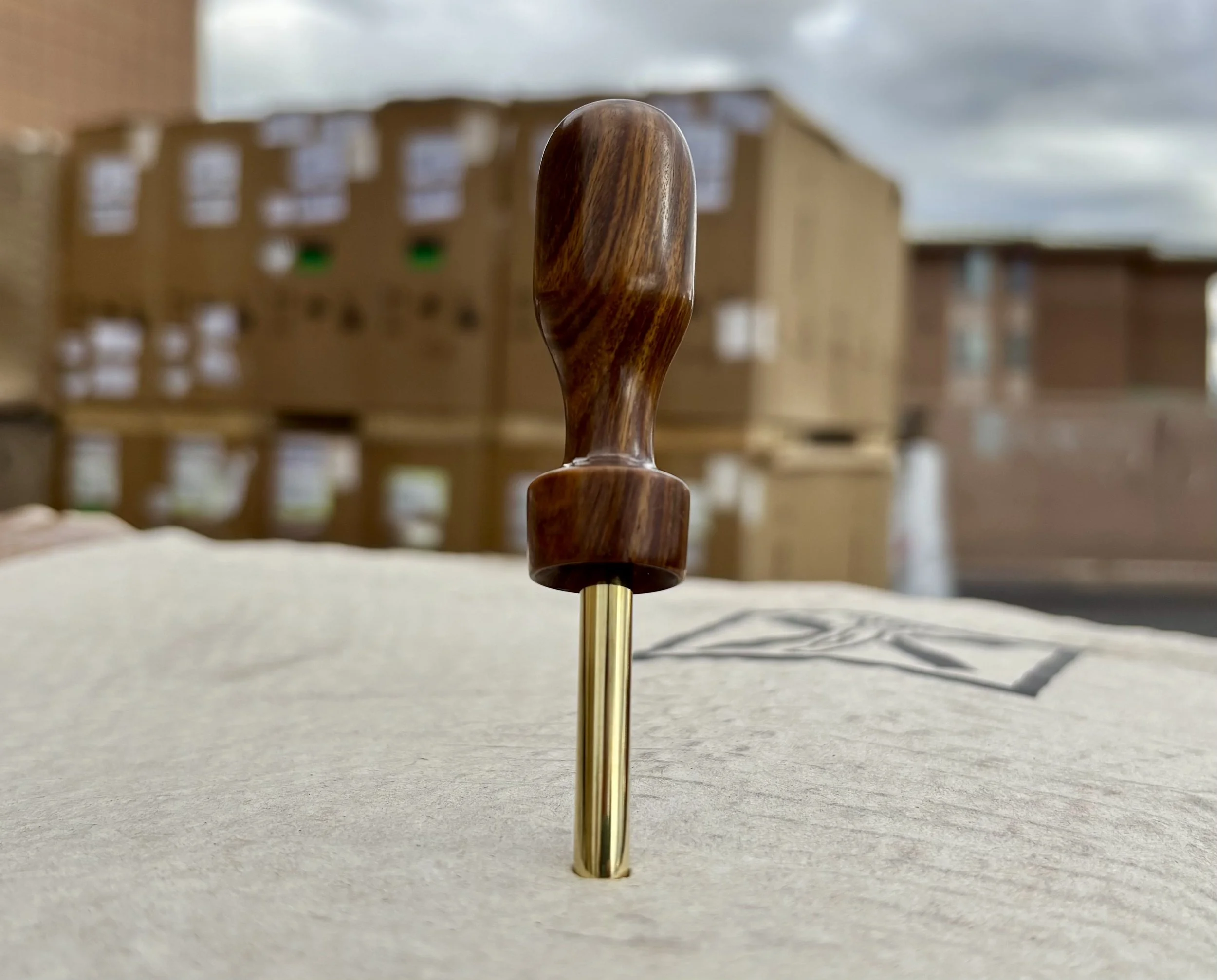 Divot tool for golf hand made from exotic wood with brass prong