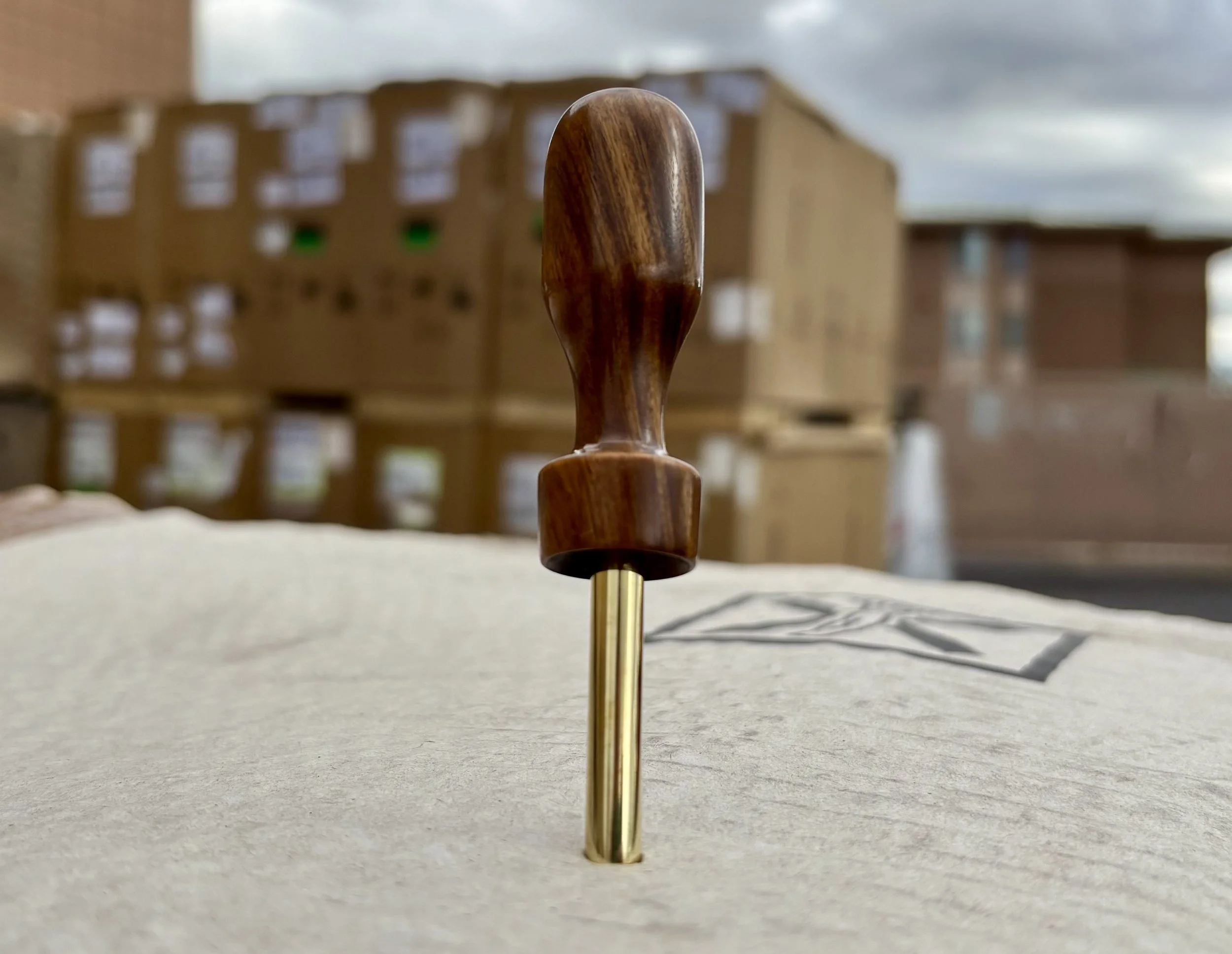 Divot tool for golf hand made from exotic wood with brass prong