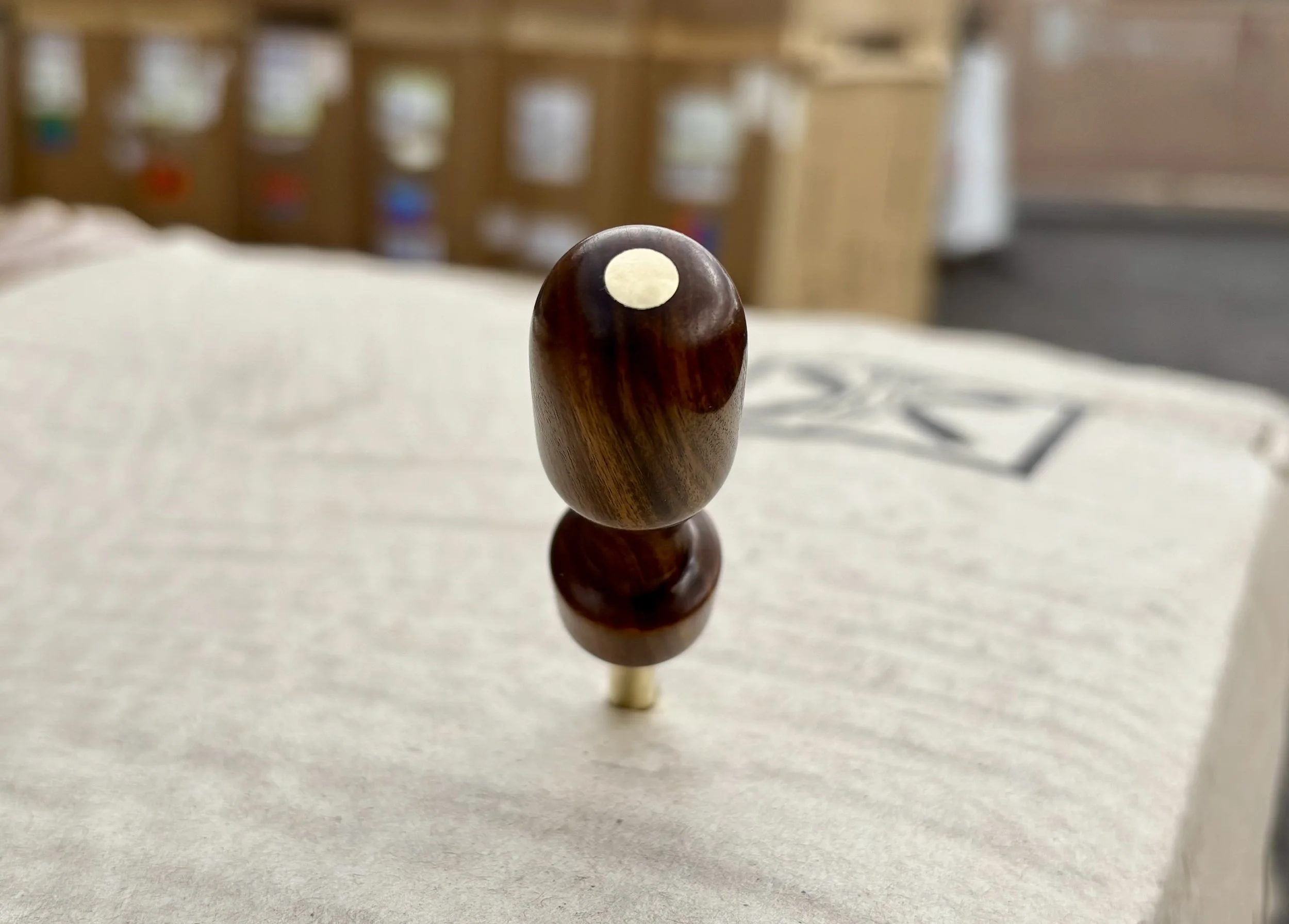 Divot tool for golf hand made from exotic wood with brass prong