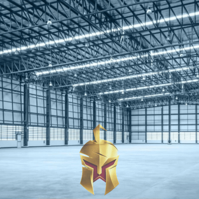 Empty Warehouse with ample lighting to keep production going. Spartan Home Pros specializes in Warehouse lighting