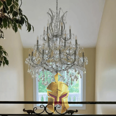 A large crystal chandelier hanging from a ceiling in an elegant room Installed by Spartan Home Pros