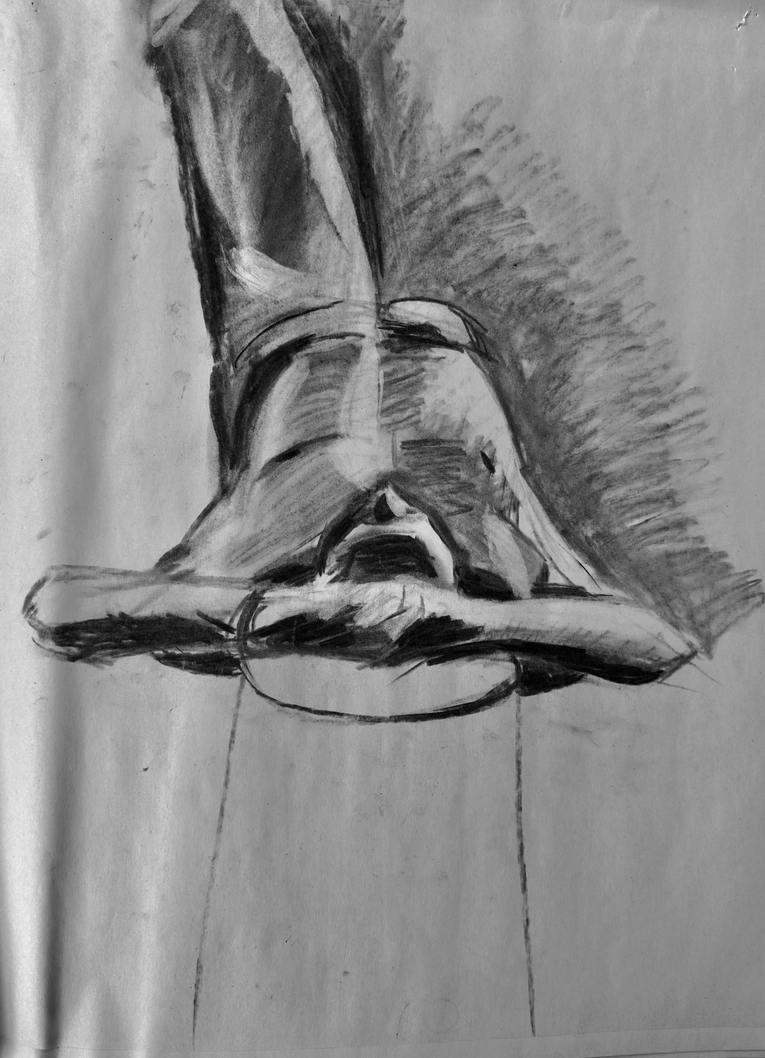 A black-and-white sketch of a person lying face down on a surface, with arms extended outward and head resting on forearms.