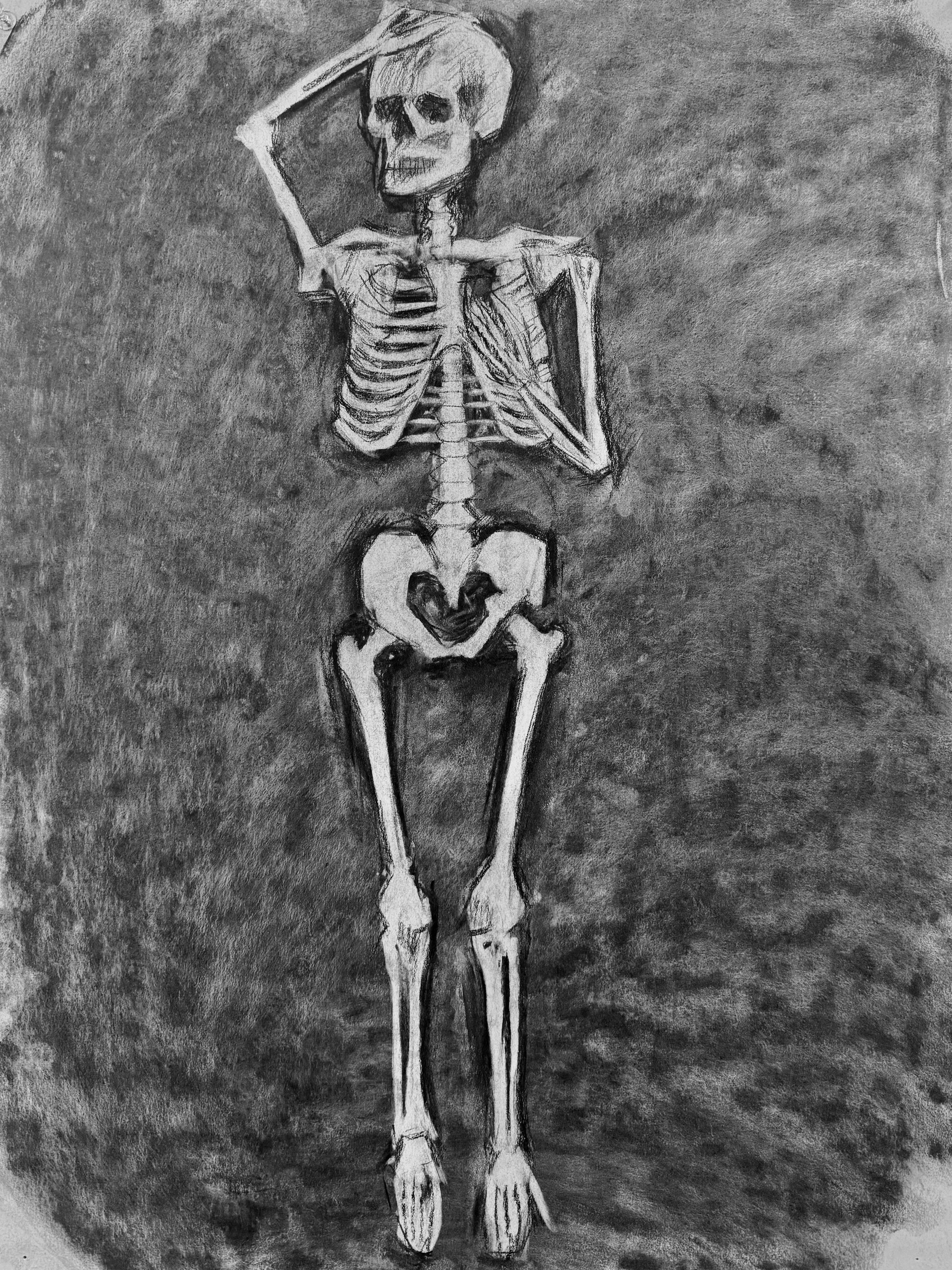 A monochrome drawing of a human skeleton lying down with one hand on its skull, sitting on the ground against a dark background.