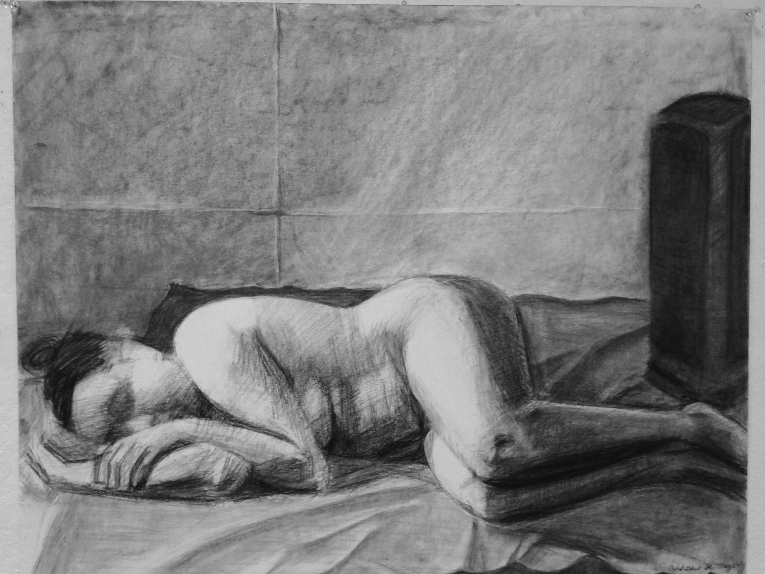 A black and white drawing of a person lying on their side on a bed, resting their head on a pillow with one arm tucked beneath it. The person appears to be sleeping or resting, with their eyes closed. There is a large piece of furniture, possibly a r