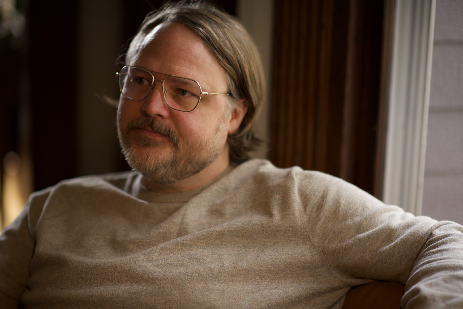 Charlie Van Stee looking to the right while sitting