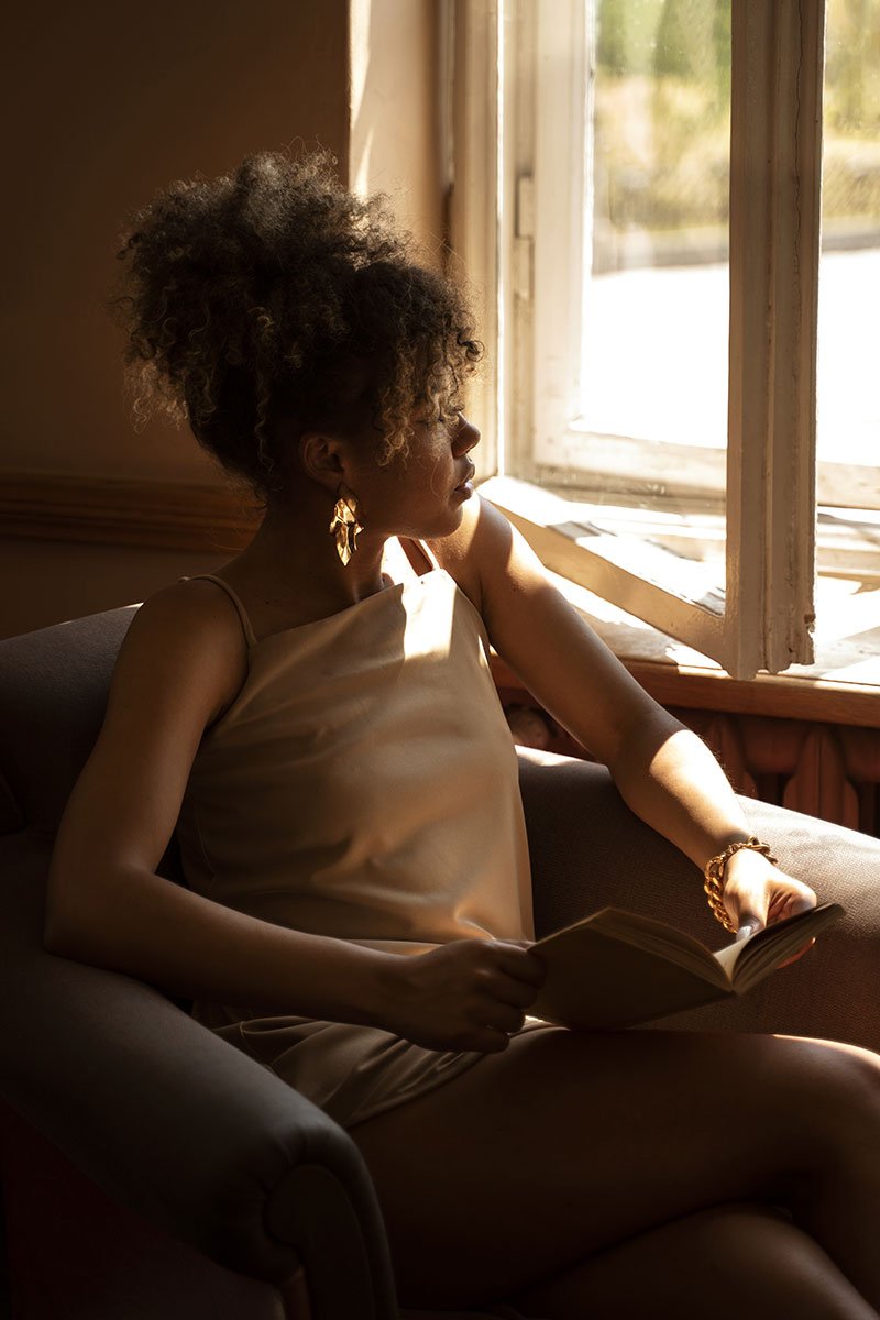 an image of a woman reading a book