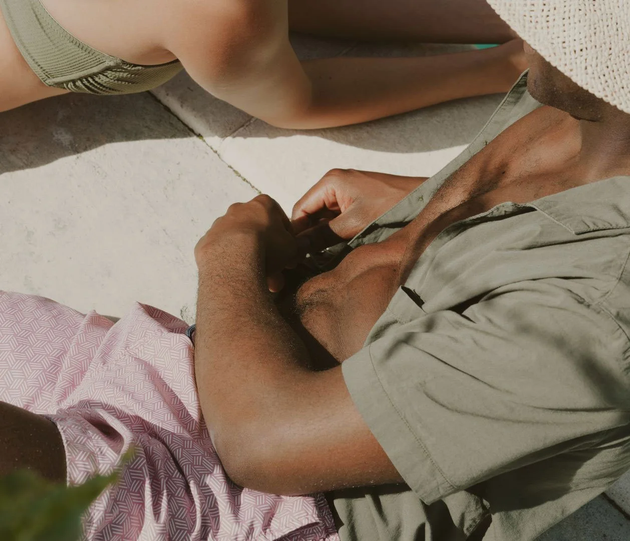 an image of a man relaxing at the pool