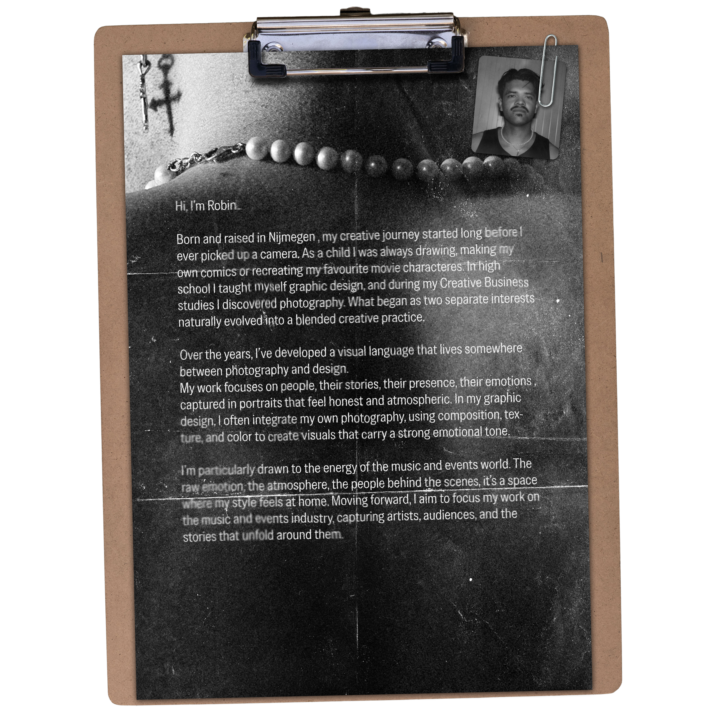 A hand holding a clipboard with a printed biography titled 'Hi, I'm Robin,' accompanied by a small black-and-white photograph of a young man with short hair and a necklace, clipped to the upper right corner of the document.