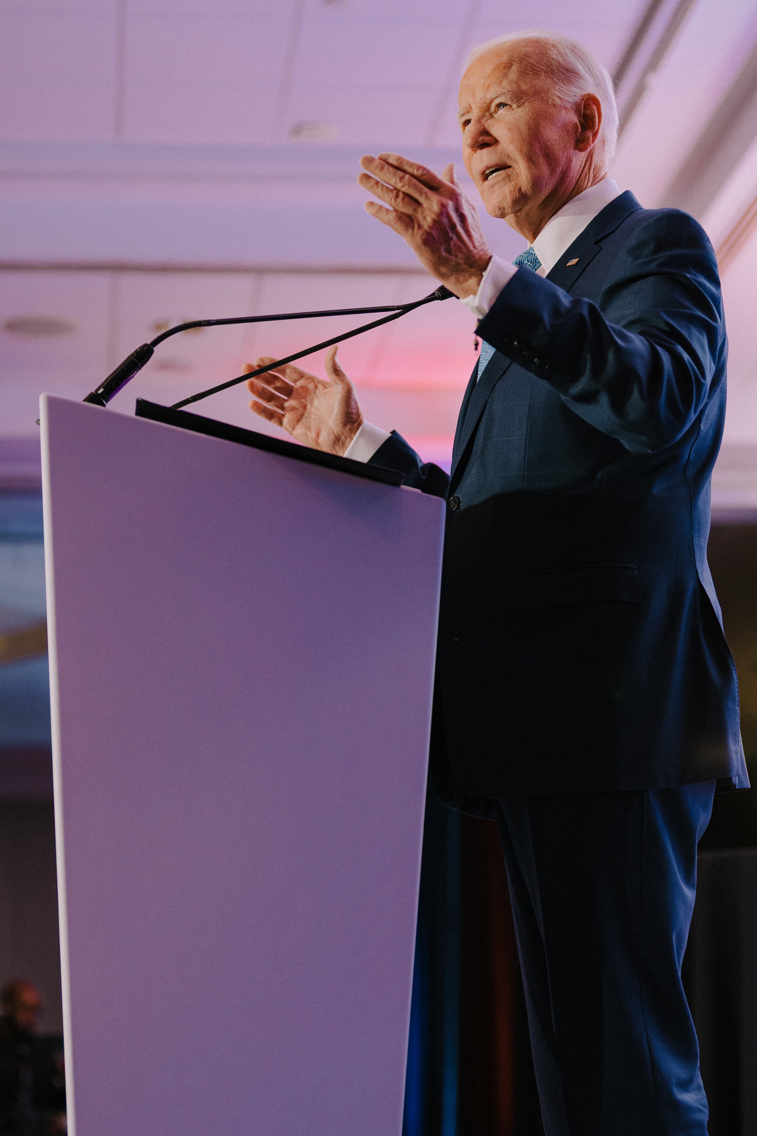 Joe Biden speaking at a podium during an event.