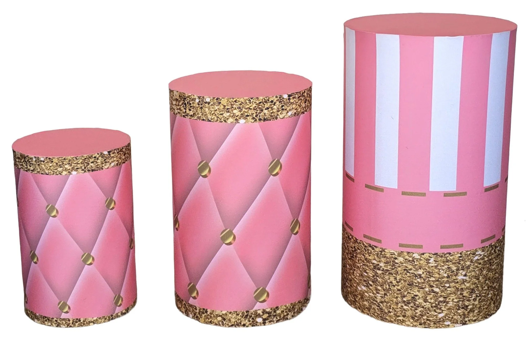 Three cylindrical gift boxes in pink with gold glitter accents, different sizes, decorated with diamond patterns, gold dots, and vertical white and pink stripes.