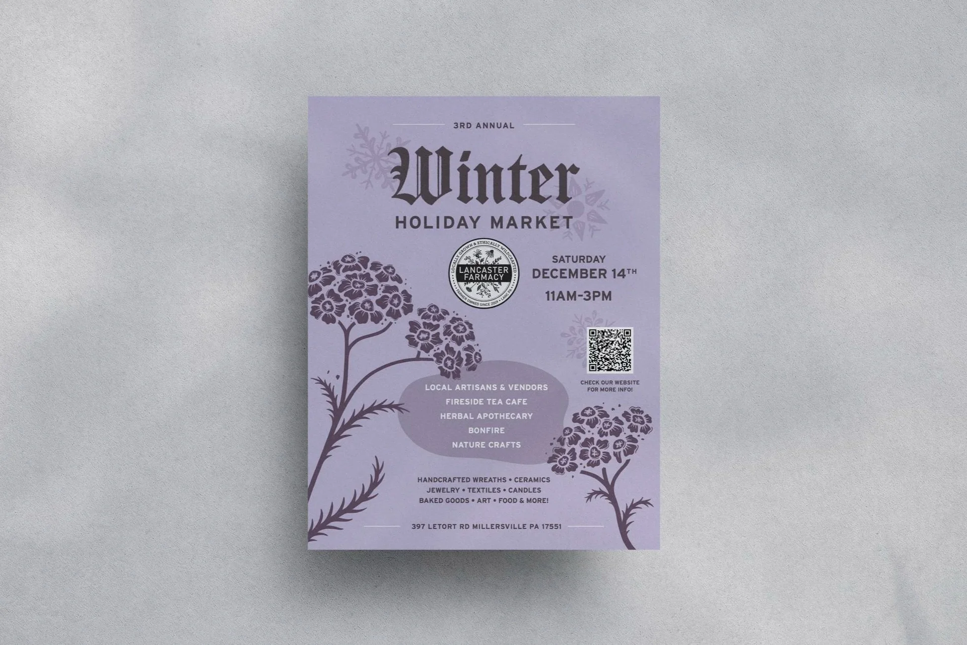 Printed winter holiday market poster on wall with shadows. Showcases graphic design work, print media design, typographic layout design.