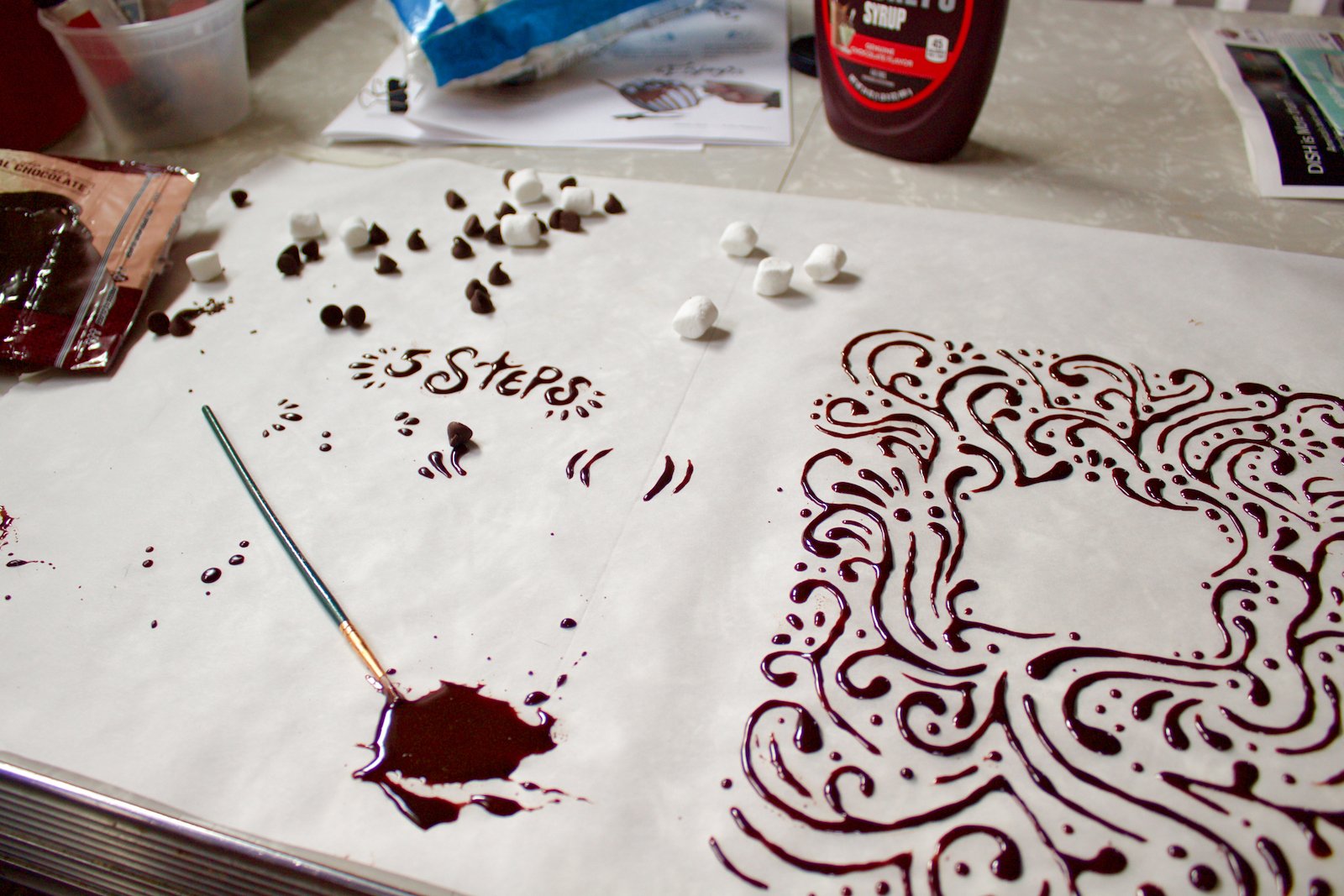 Behind the scene image of how I painted with chocolate for the editorial design.
