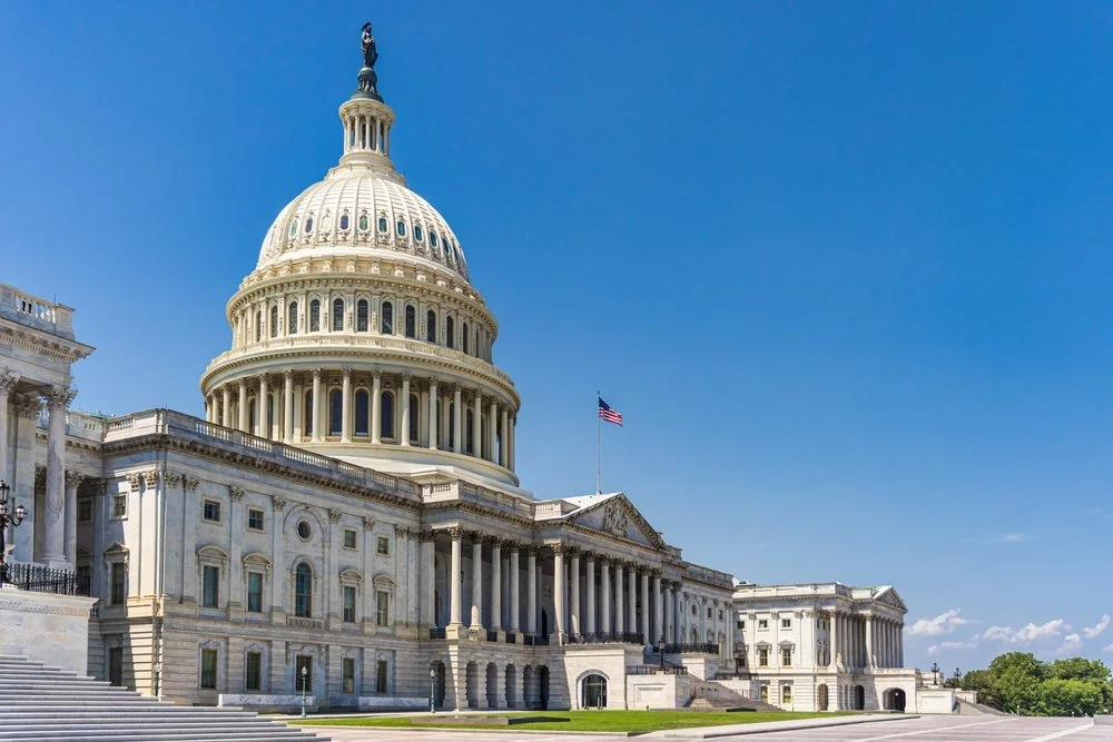 The United States Capitol building with a clear blue sky in Washington, D.C.