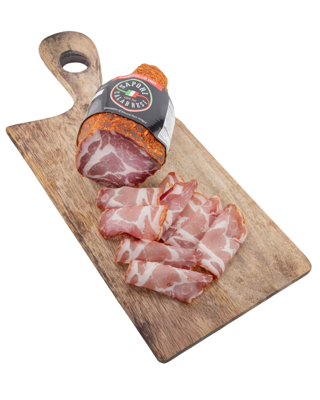 Sliced cured pork belly on a wooden cutting board with whole piece wrapped in black label.