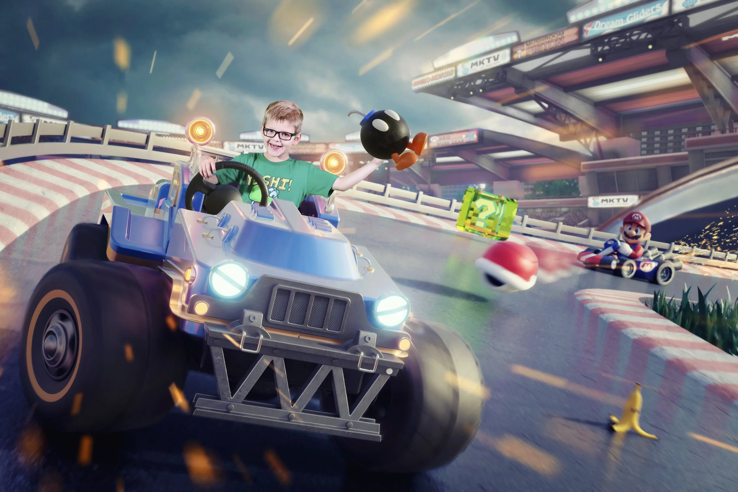 A young boy with glasses smiling and holding a Green Shell while sitting in a go-kart on a Mario Kart race track. In the background, Mario is in another go-kart, with floating question mark blocks and a Poké Ball flying near the track, under a stadium-like structure with bright lights and banners.
