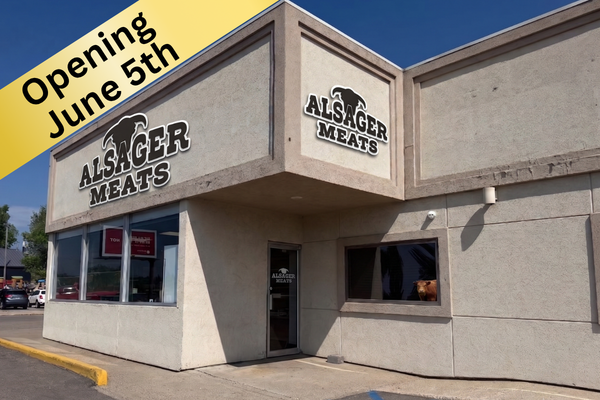 Exterior of a building with signs for Alger Meats, announcing opening on June 5th.