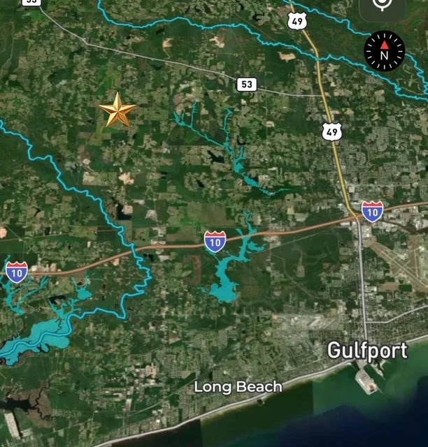 Map showing the Gulfport and Long Beach area with highways I-10 and highway 49, featuring a gold star marker and water bodies like lakes or reservoirs.