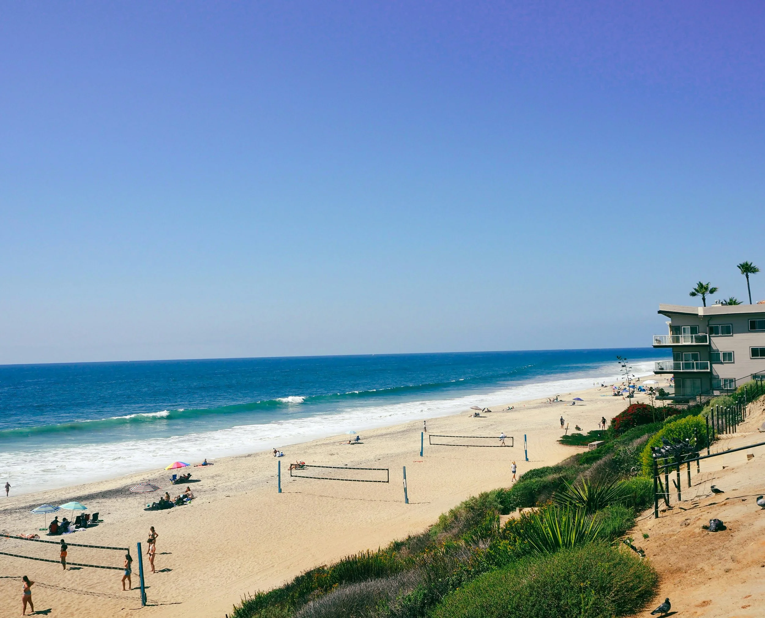 Sunny beach scene in Carlsbad, California representing healing, relaxation, and improved quality of life through chiropractic care