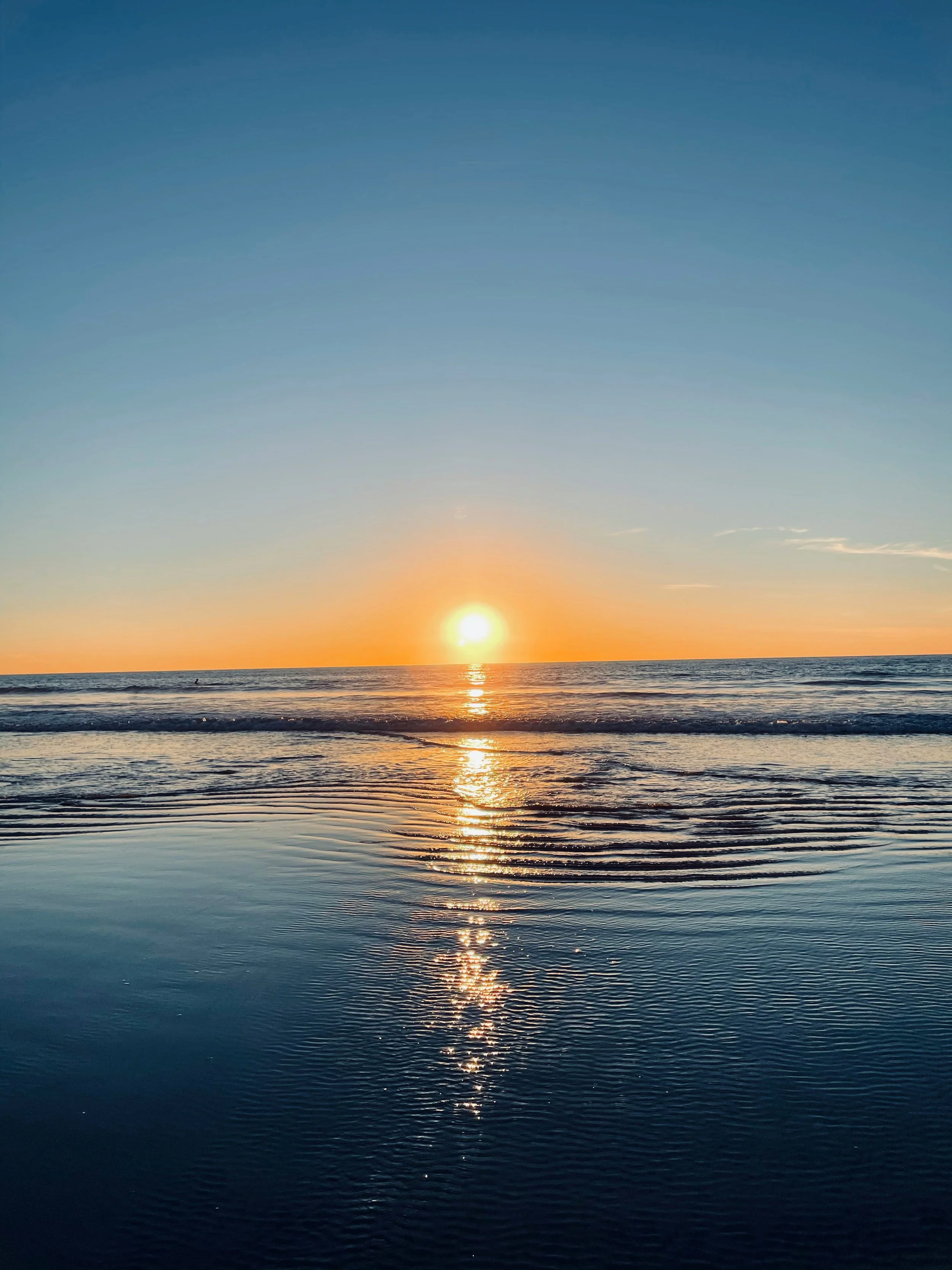 Sunset over the ocean in Carlsbad, California representing relaxation, healing, and wellness