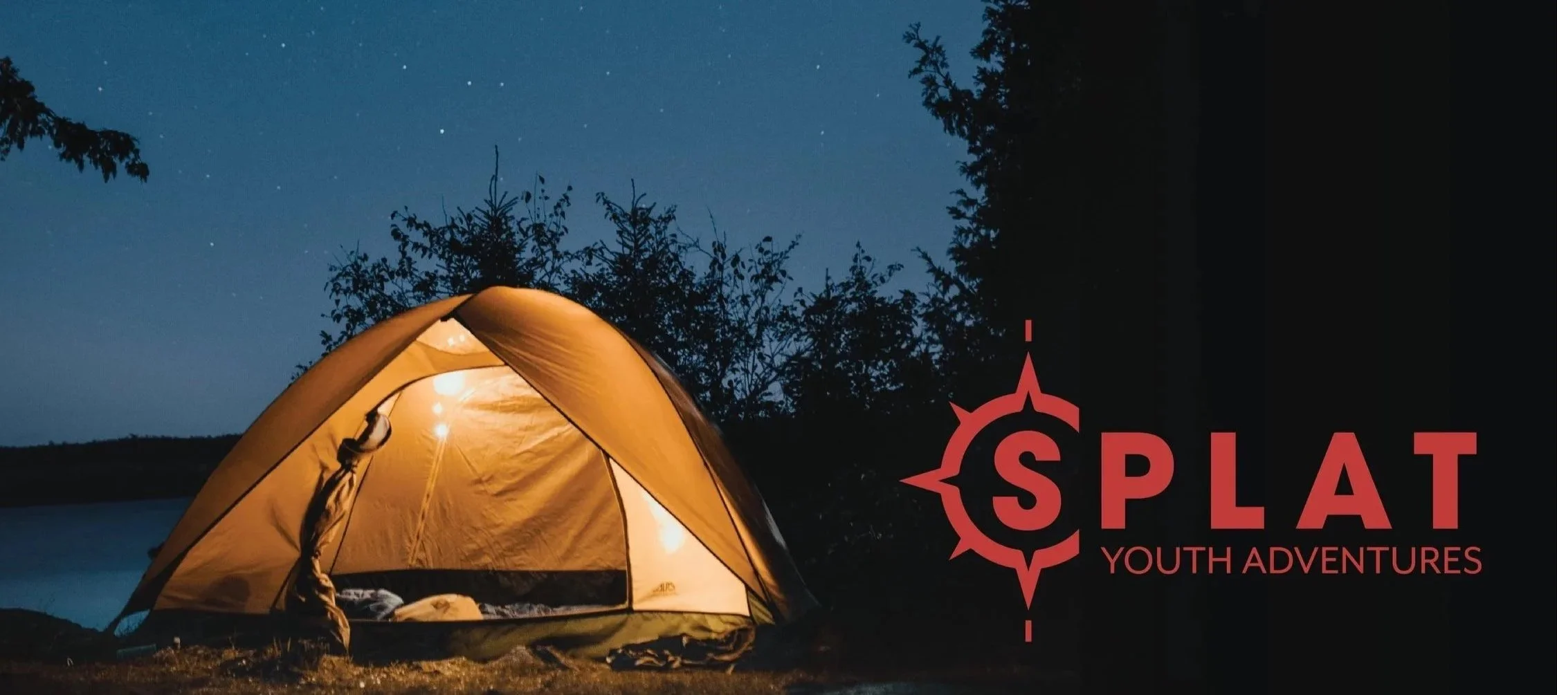 A Camping tent illuminated from the inside, set up near a body of water at night with trees and stars in the sky. The logo reads 'SPLAT Youth Adventures' with a compass rose design.
