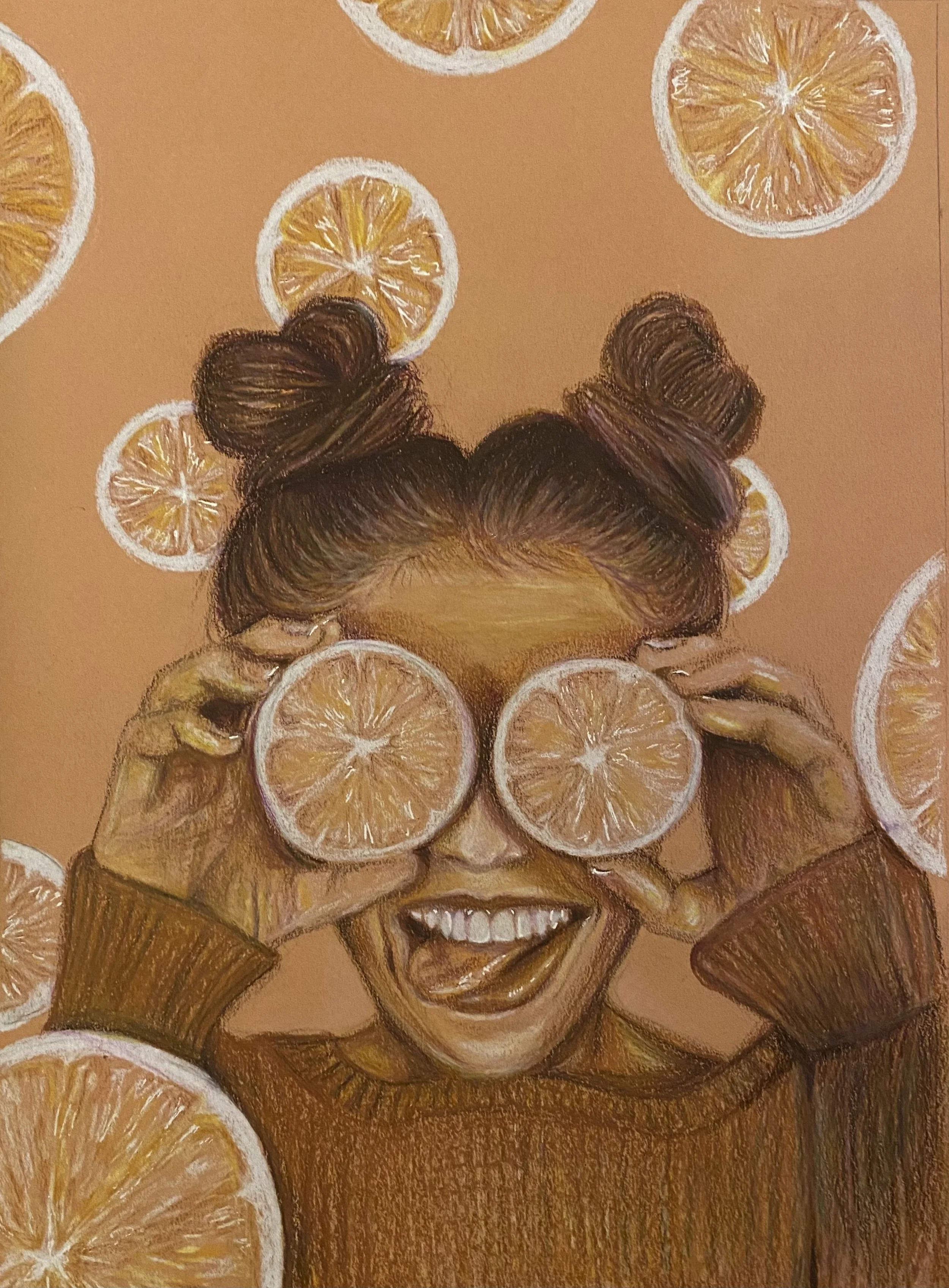 A woman with brown hair styled in two buns holding slices of orange over her eyes, smiling, with more orange slices floating around her on a peach-colored background.