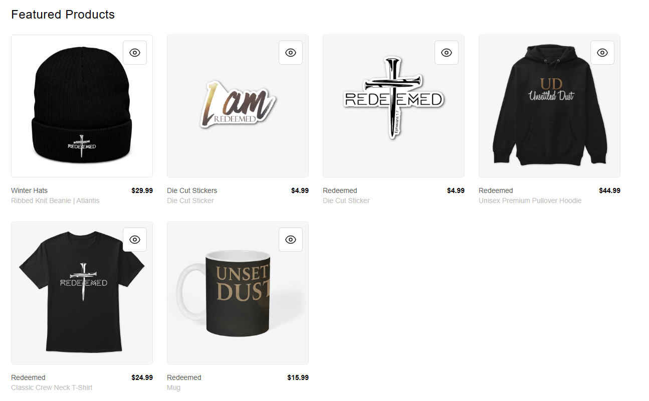 Online store display of Christian-themed merchandise including a black ribbed knit beanie with a cross, die cut stickers with religious phrases, a black hoodie with Christian text, a black T-shirt with a cross and text, and a mug with the phrase "Unstoppable Dust."