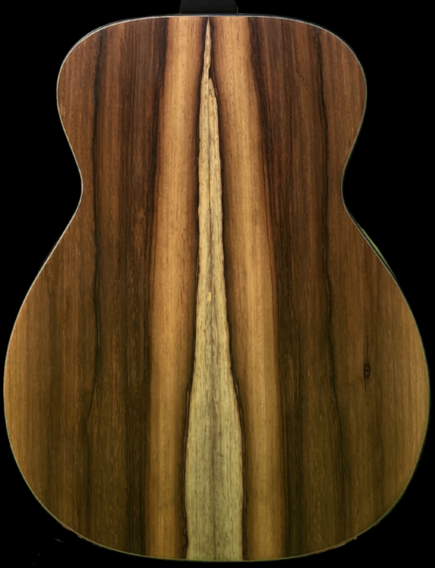 Close-up of a wooden guitar top showing the natural wood grain patterns and a central seam.