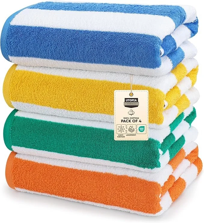 Stack of four colorful towels in blue, yellow, green, and orange with a tag indicating they are 100% cotton, pack of 4.