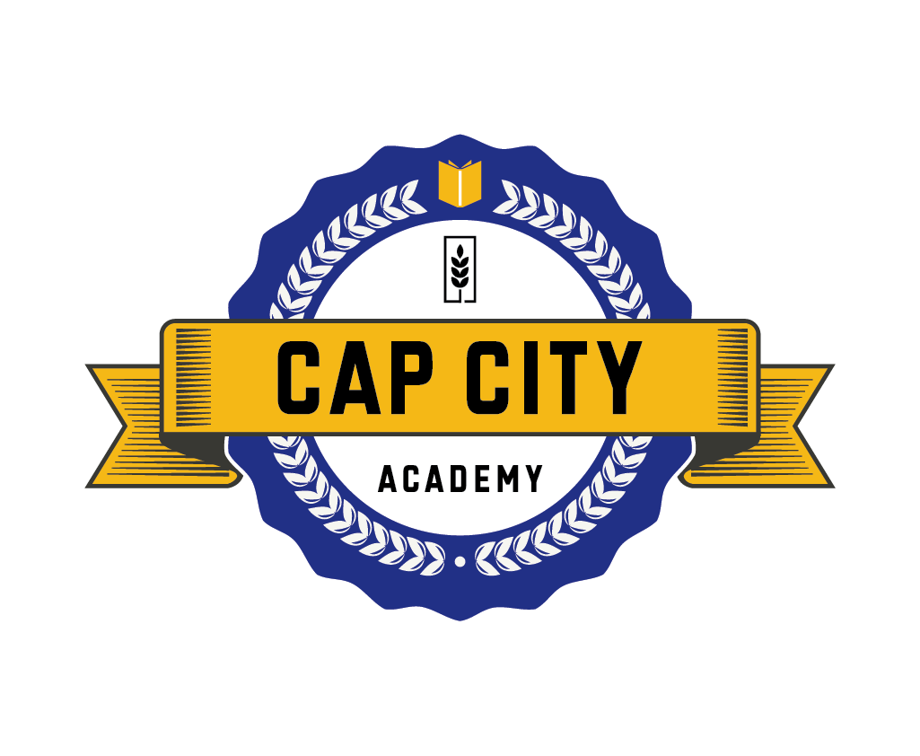 Badge with the words "Cap City Academy," featuring a blue and white emblem with a yellow ribbon.