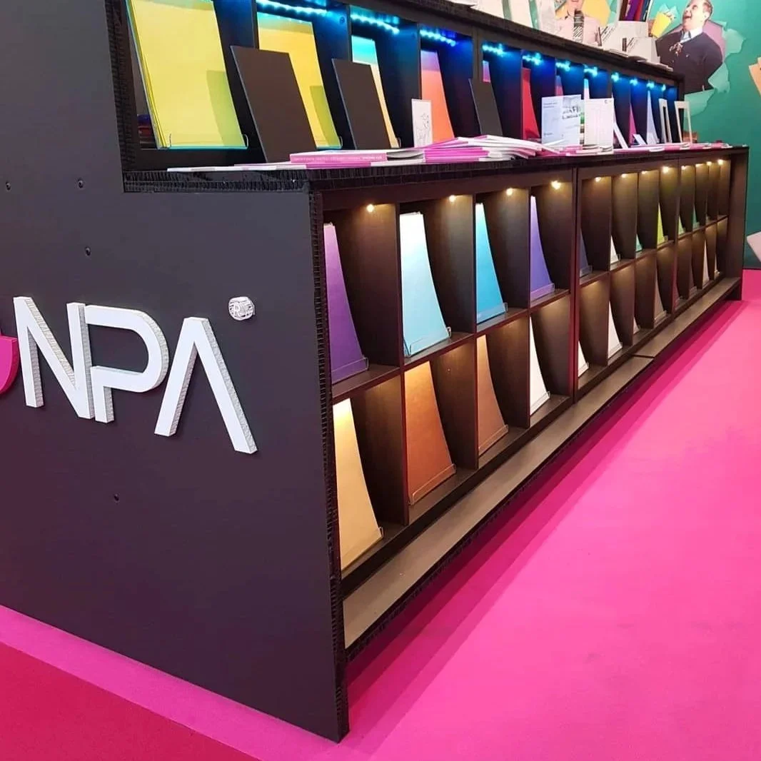 This vibrant exhibition bench was designed for a client at Re-board Technology AB, showcasing a sleek, modern structure built with eco-friendly Re-board material. The colorful display setup, featuring integrated lighting and storage, highlights its v