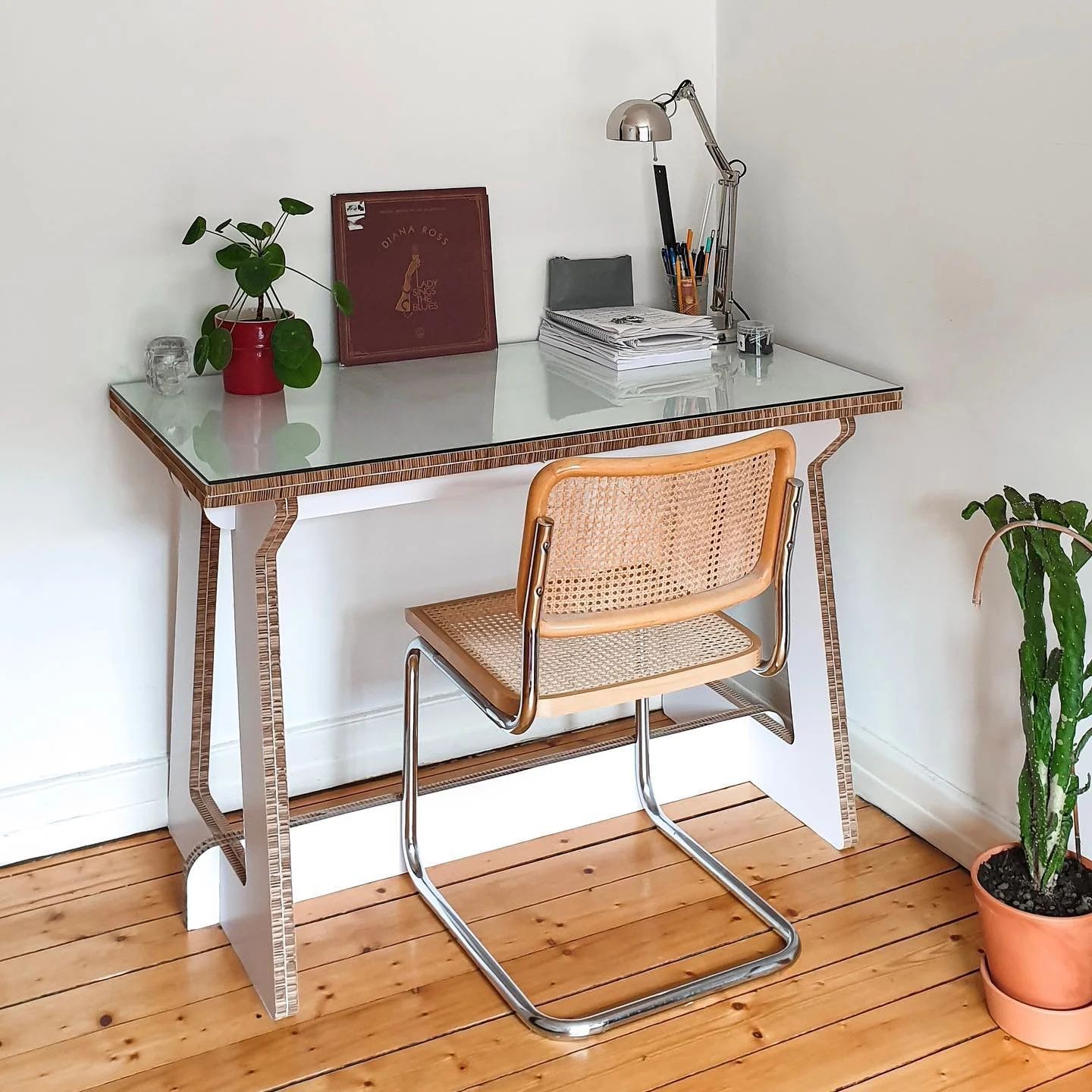 This desk was designed for my friend, who bought a glass top from a second-hand shop, with me using its measurements to craft it on my free time using Re-board. Its sturdy frame blends modern design with practical use, creating a sustainable workspac