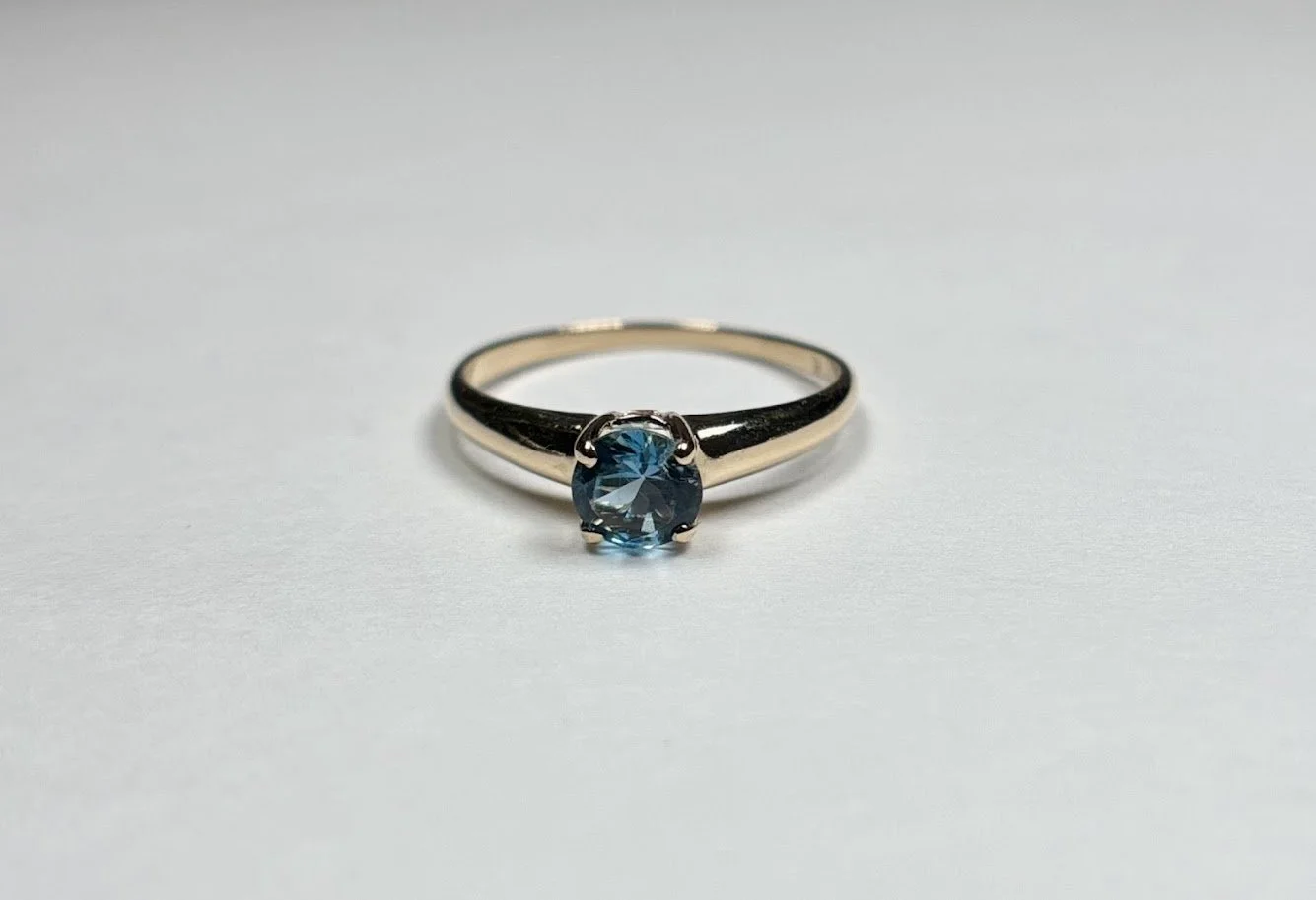 Contemporary Blue Topaz Solitaire Ring in 14K Yellow Gold
