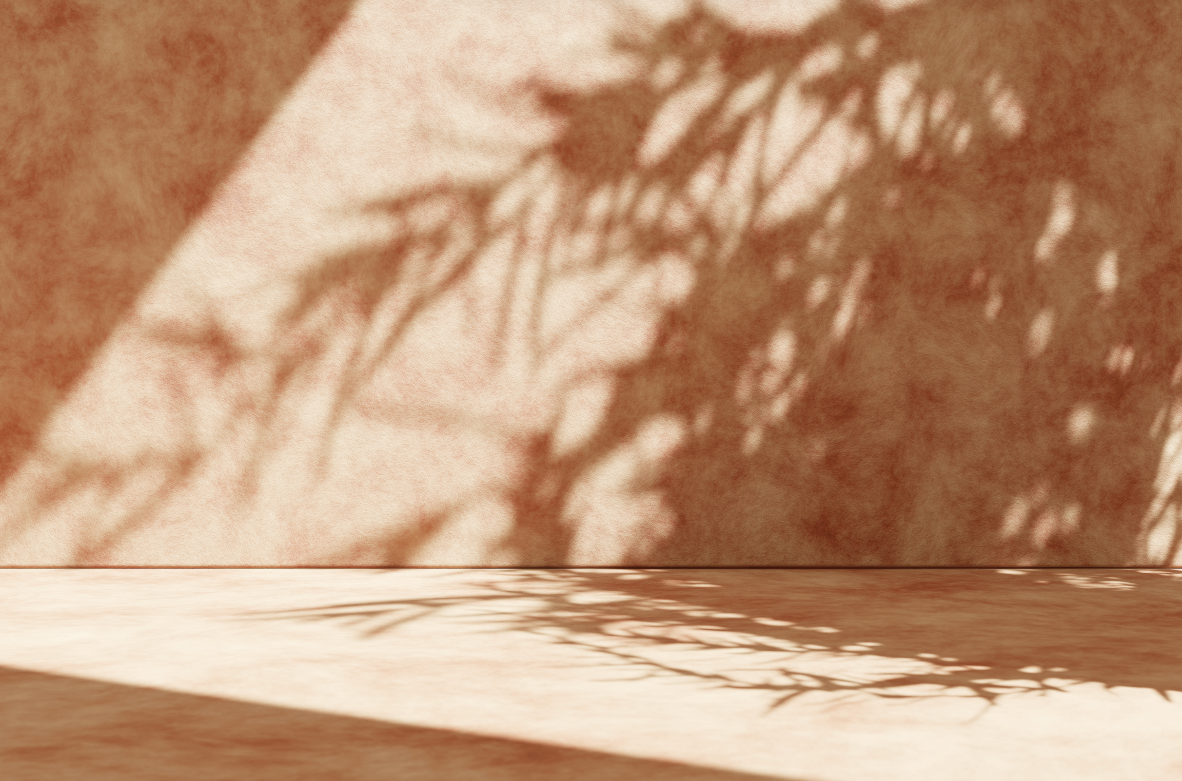 Shadow of a plant on a textured pinkish wall and floor, with sunlight creating patterns.