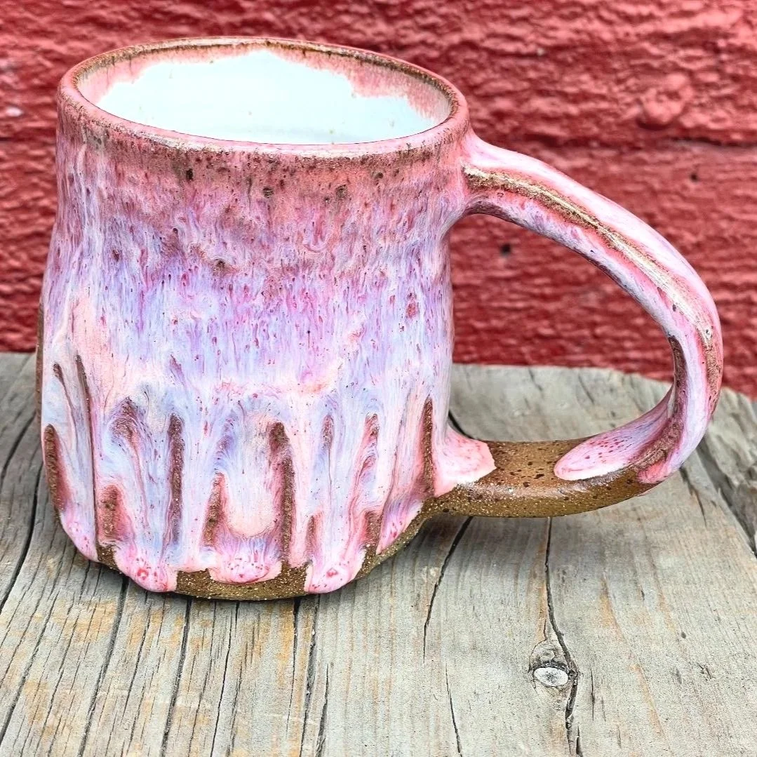 pink gloss glazed carved mug in brown speckled clay