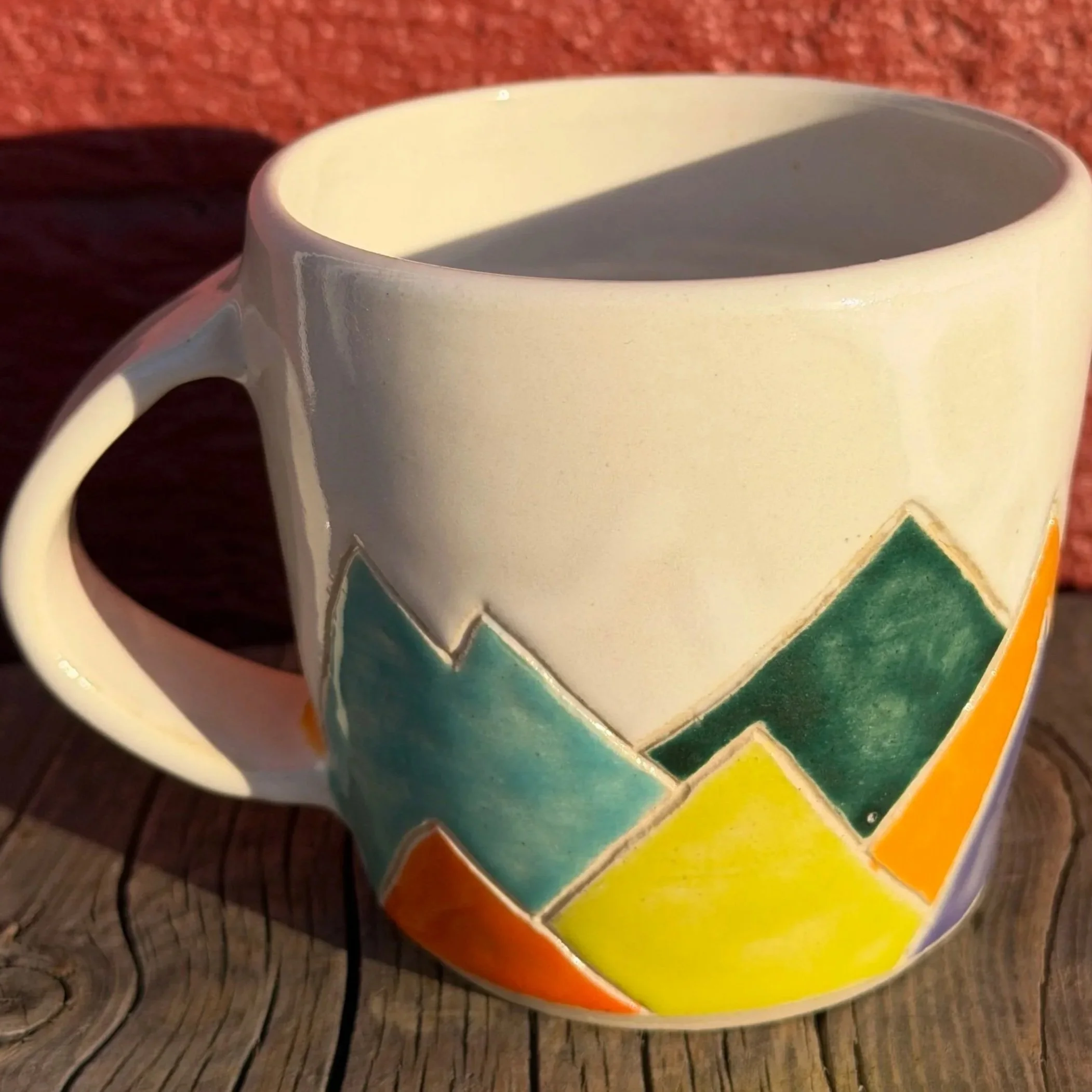 Multi-colored mountain mug in white clay