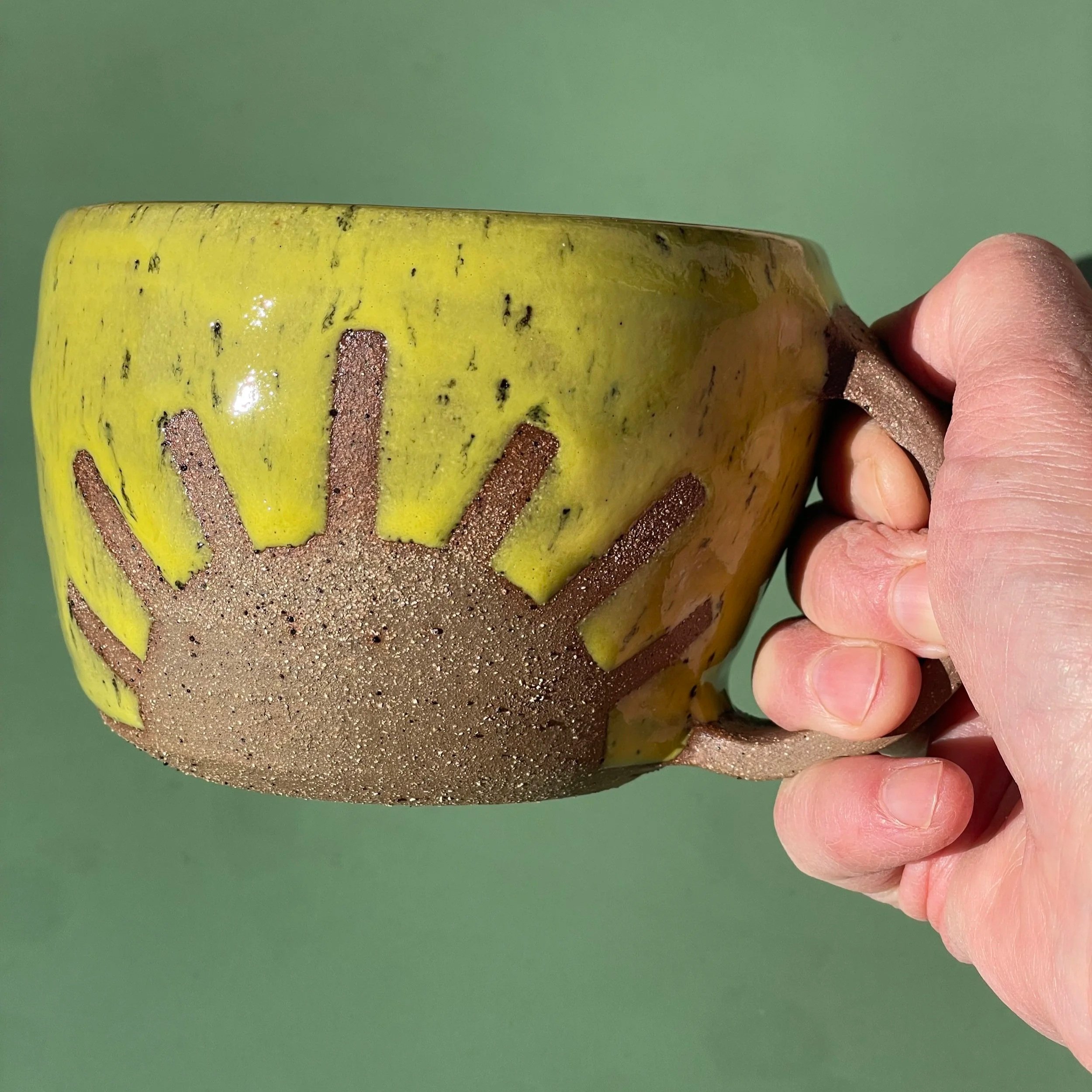 Handmade wheel thrown yellow sunshine on brown clay with speckles mug modern design stoneware