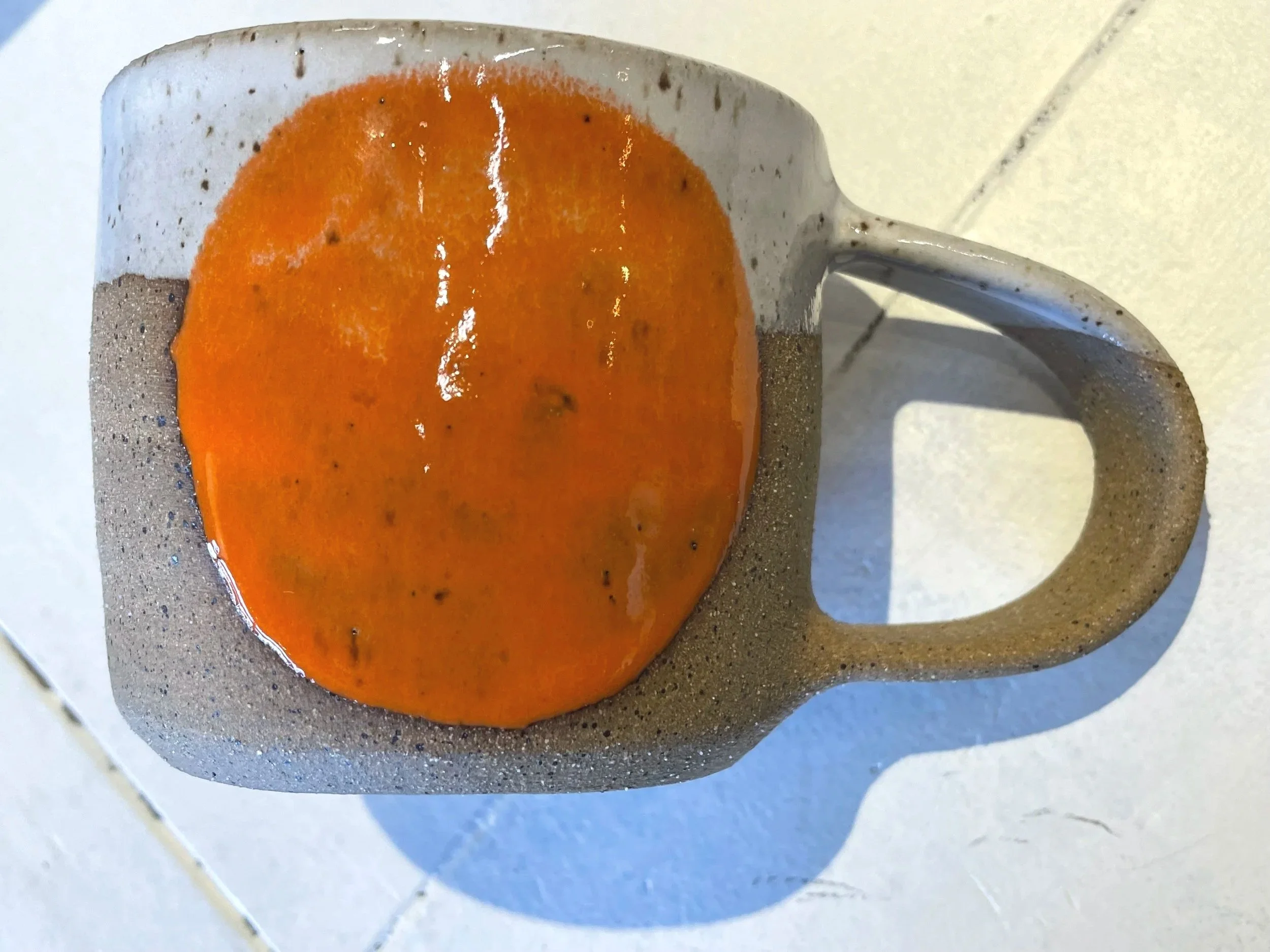 Retro orange gloss circle glazed mug in brown speckled clay