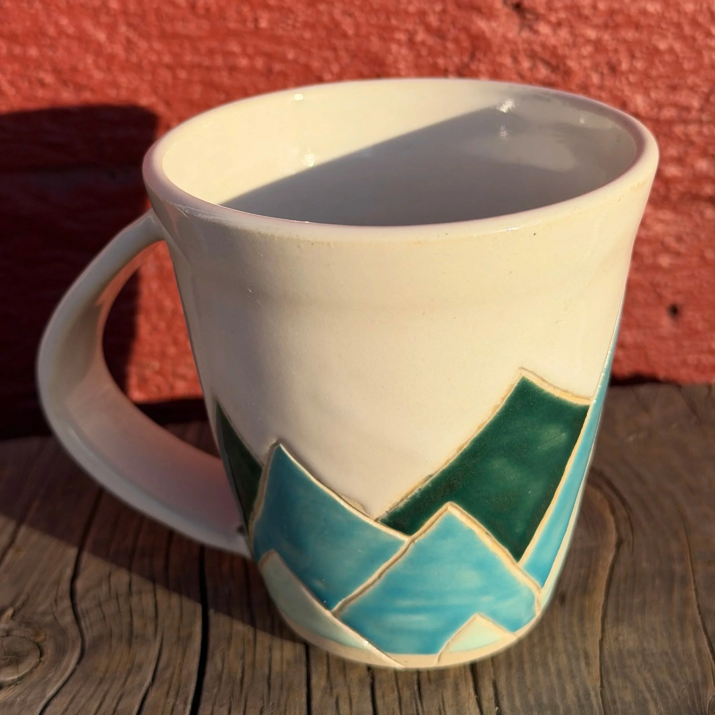 Multi-colored mountain mug in white clay