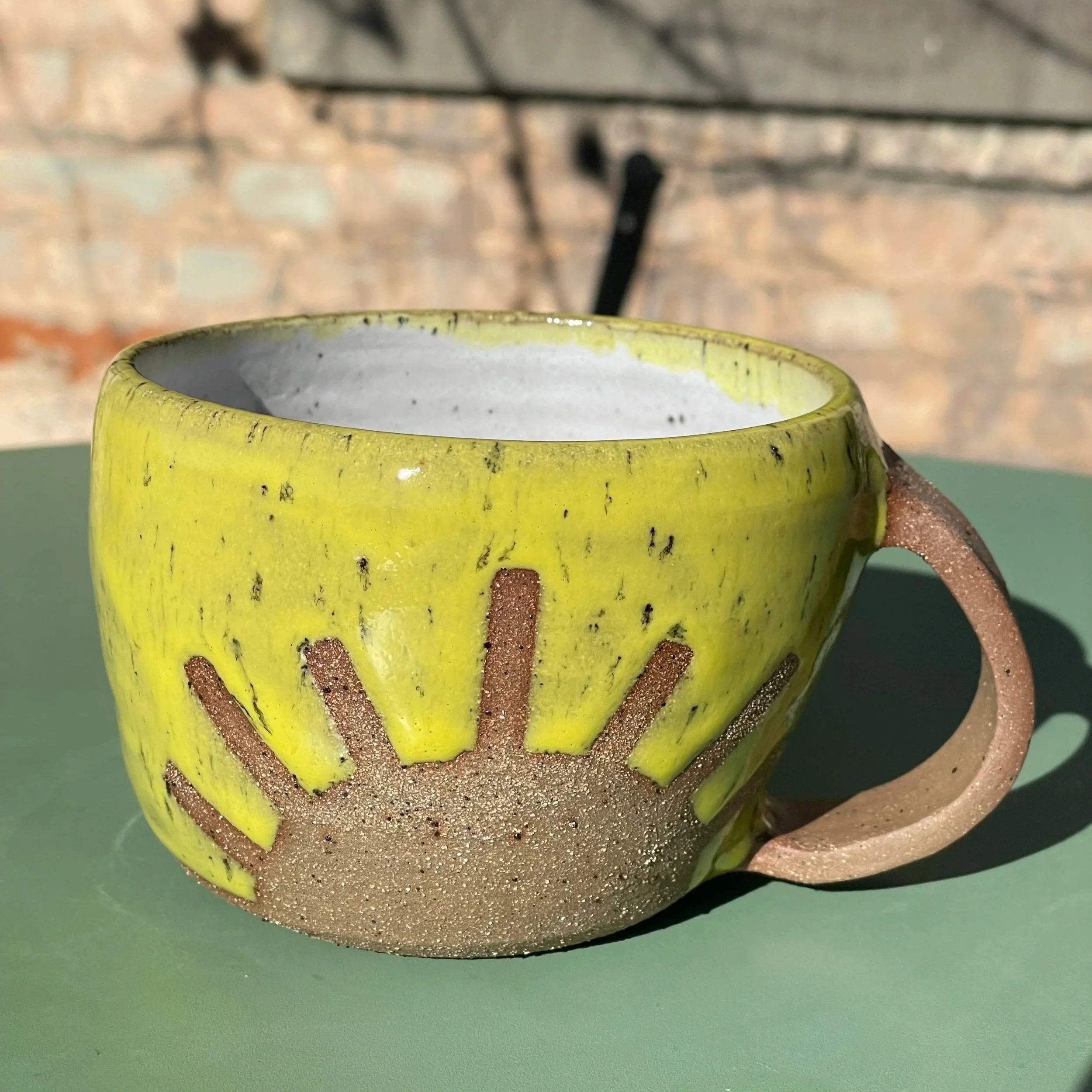 Handmade wheel thrown yellow sunshine on brown clay with speckles mug modern design stoneware