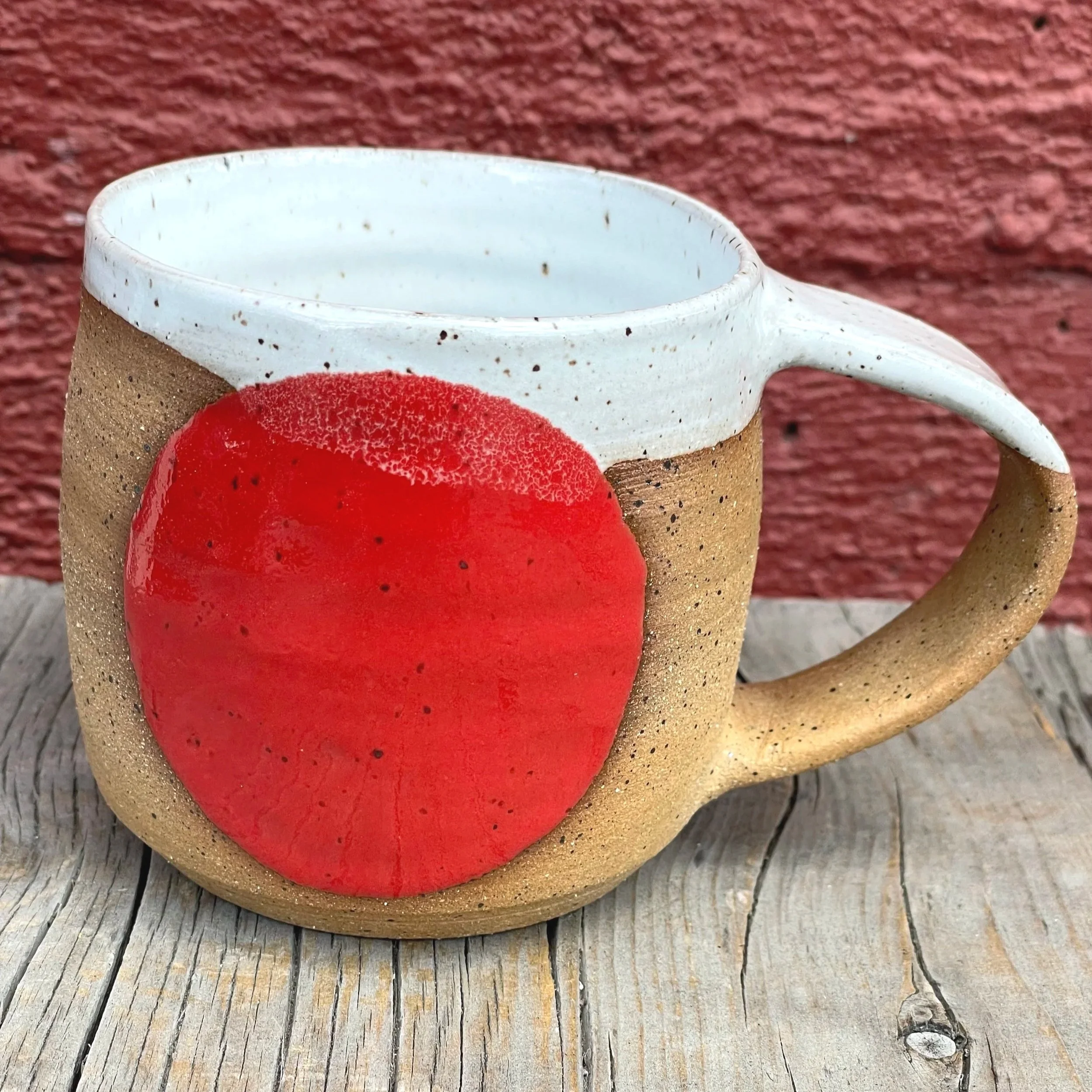 Retro red gloss circle glazed mug in brown speckled clay