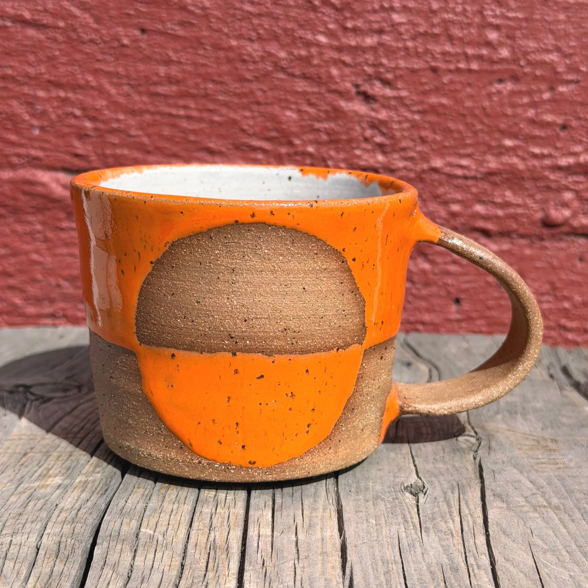 Mid-century modern half-circle glazed mug in brown speckled clay