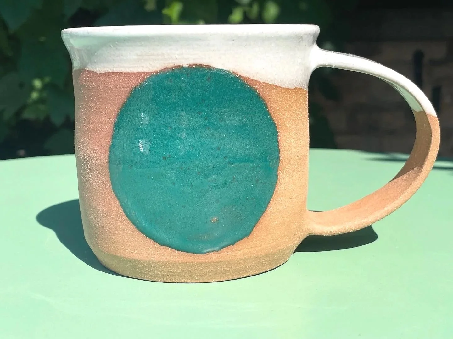 Retro teal gloss circle glazed mug in brown speckled clay