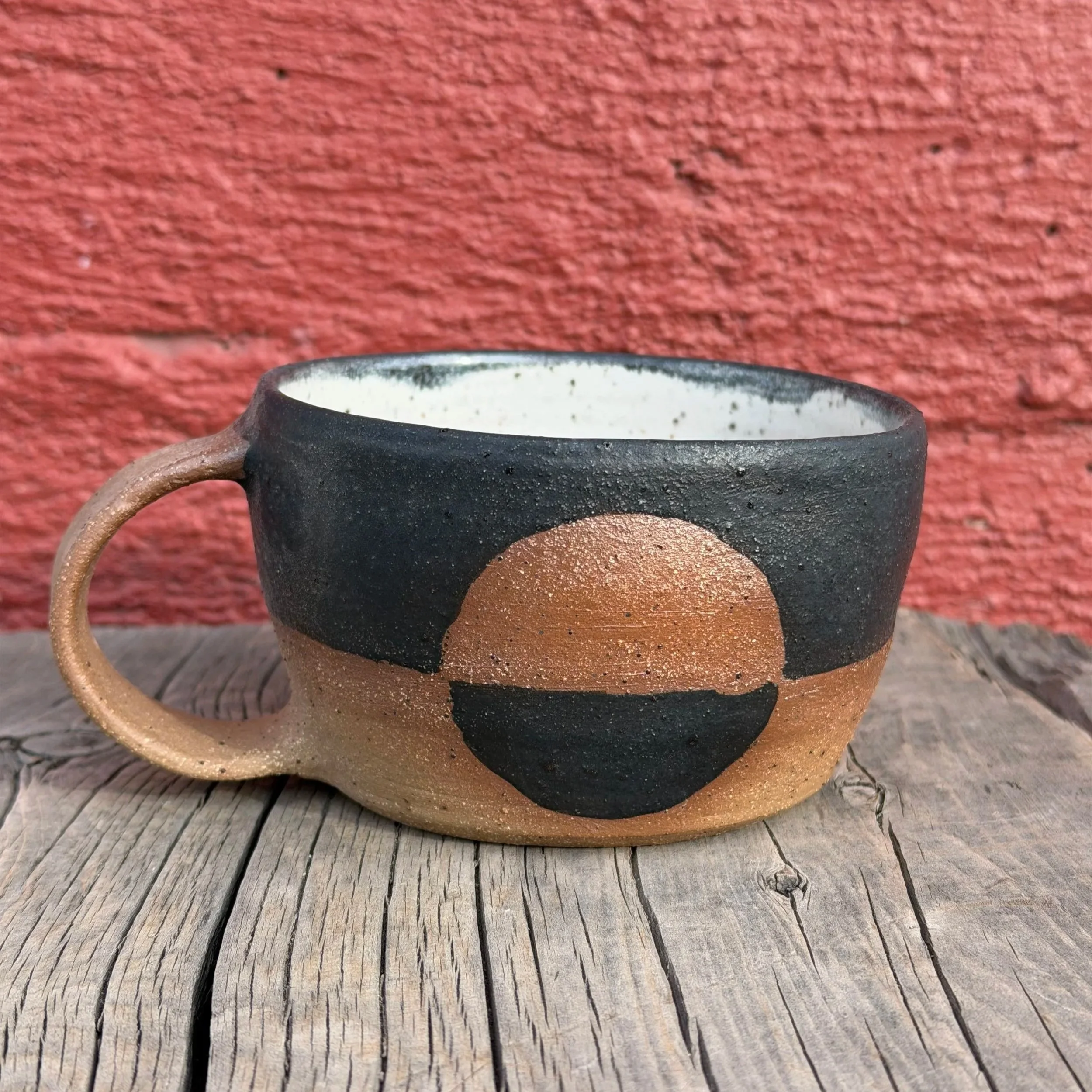 Handmade wheel thrown matte black glaze with half-circle on brown clay with speckles mug modern design stoneware mid century modern