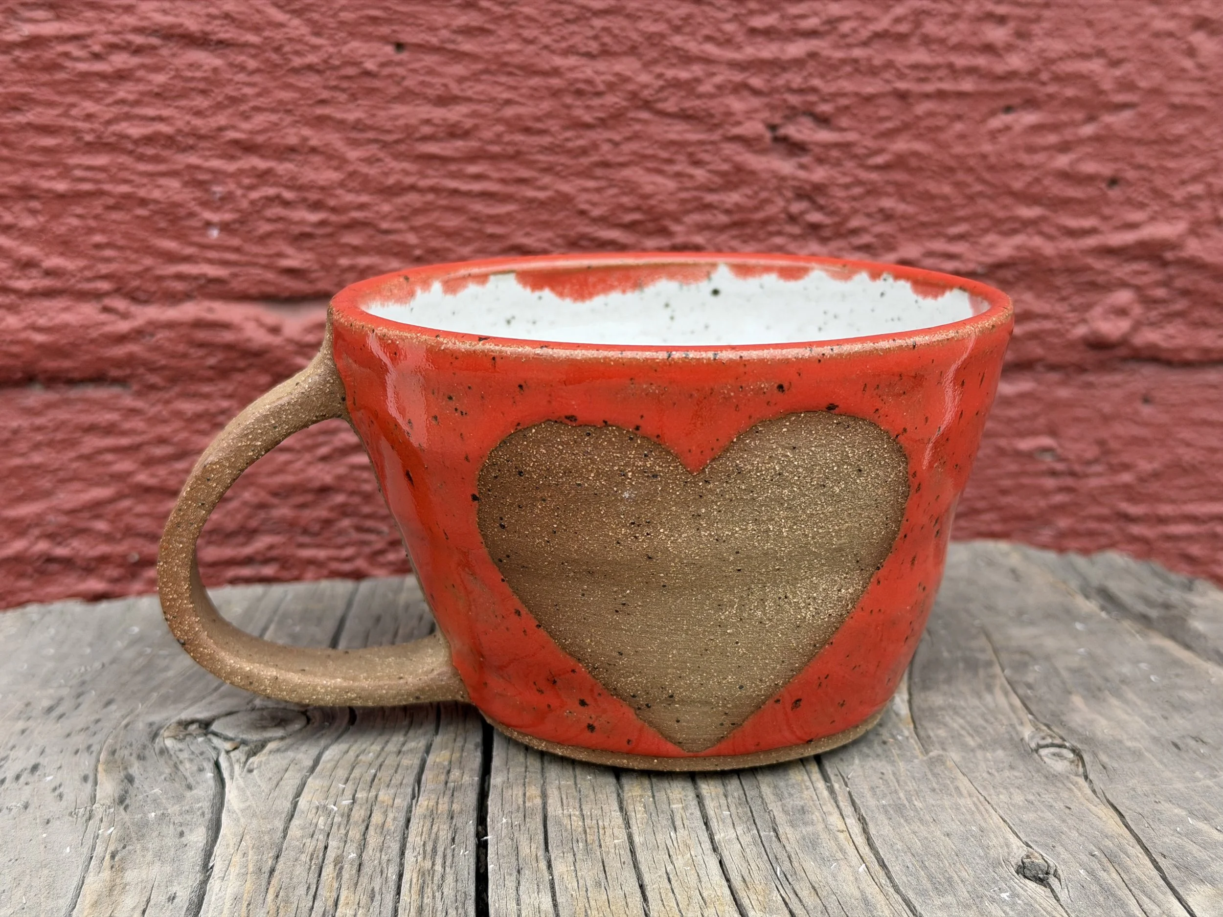 Burn out heart glazed mug in brown speckled clay