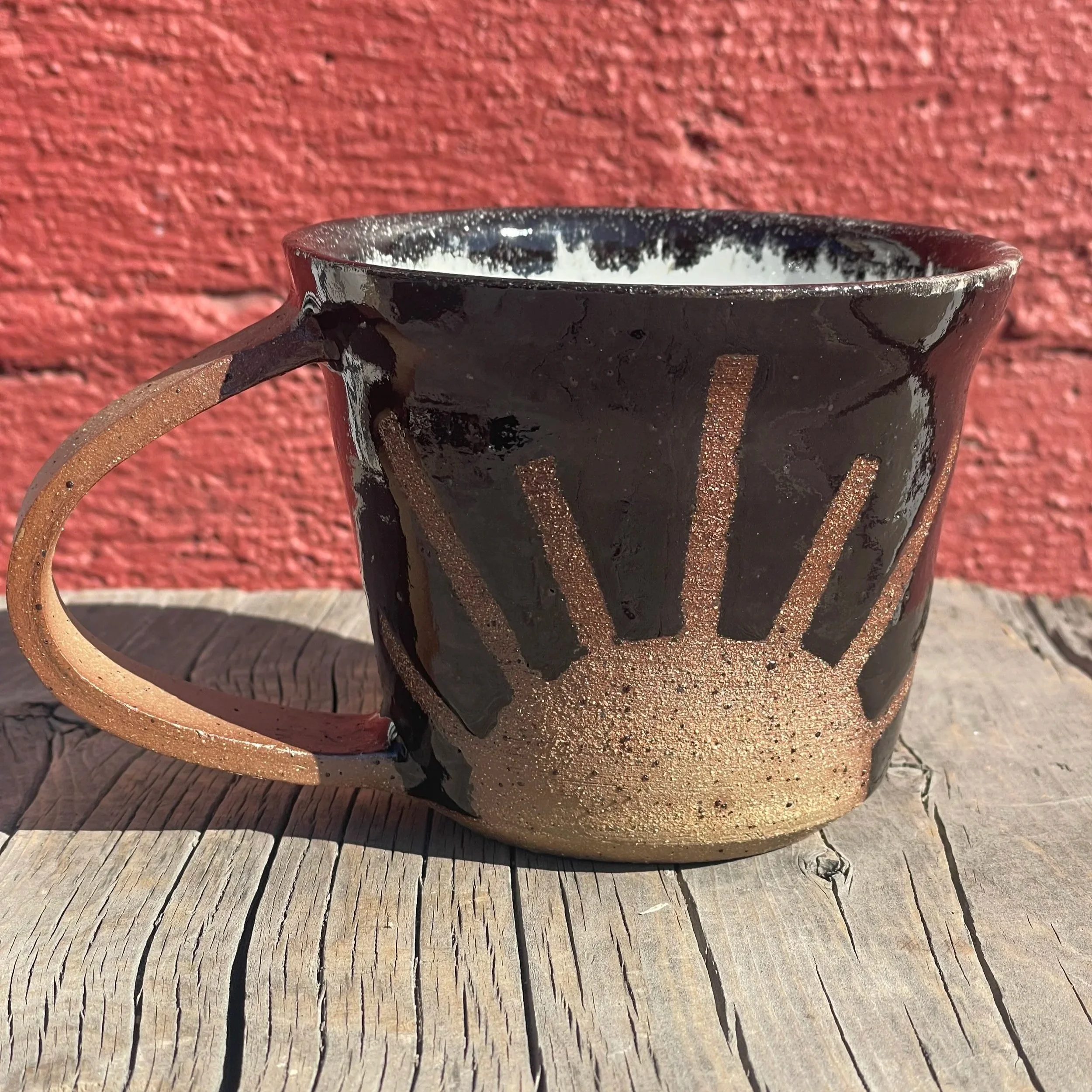 Bright colored sunshine mug in brown speckled clay