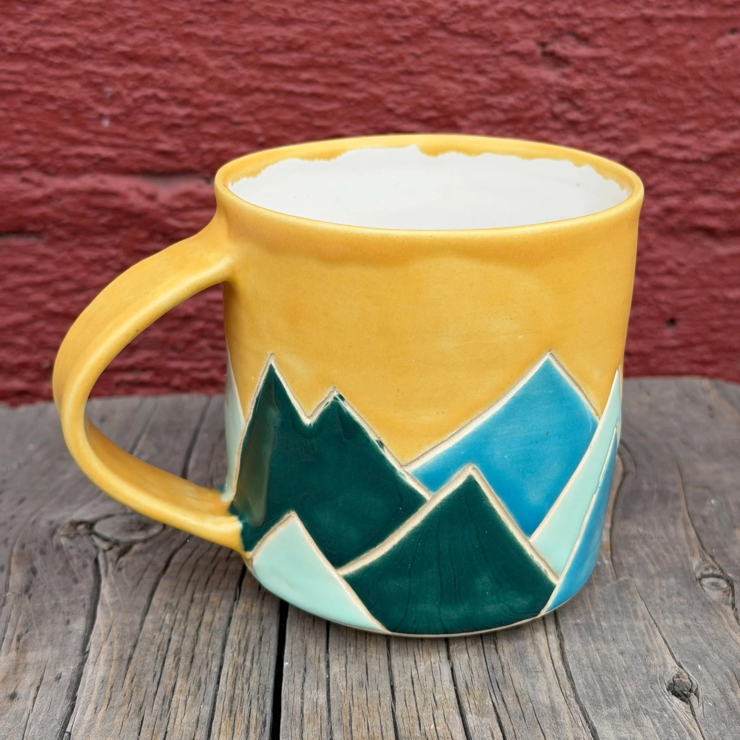 Multi-colored mountain mug in white clay