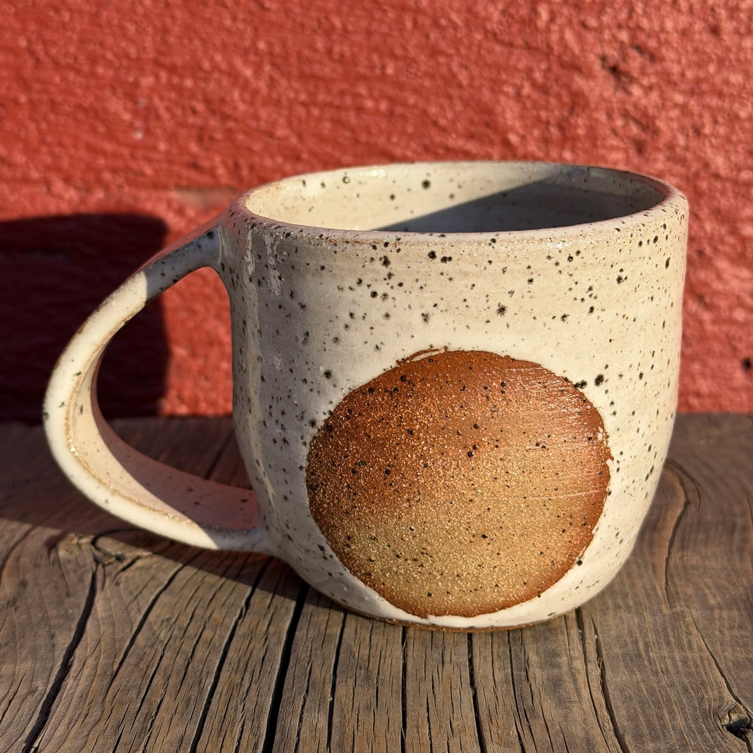Burn out circle glazed mug in brown speckled clay